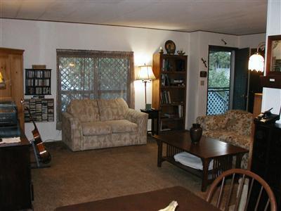 INDEPENDENCE BEGINS by owning your own home. This spacious home has the best location & biggest yard on the duck pond in Wingspread park. Such a feeling of privacy-from the front porch to the big, fenced backyard. Front & back covered decks for lazy summer afternoon enjoyment. Open the door & you'll be surprised by the entertainment size living room. Large rooms with space for your king-size bed in the master & bed & desk in the 2nd bedroom! Newer roof, heating & A/C, washer & dryer, refrigerator, dishwasher, laminate floors & front porch. All this at a price that's hard to believe!