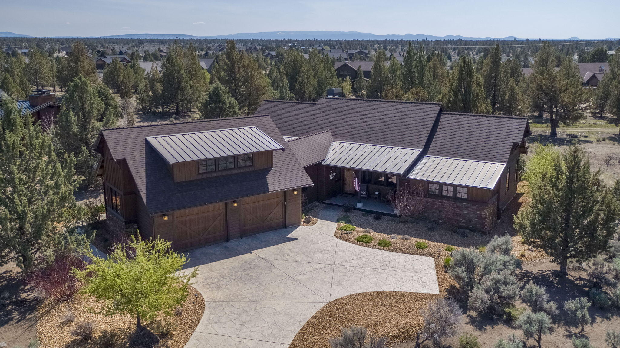 Enjoy peaceful Westside living at Brasada Ranch in this stunning single-level, 3-bed/3-bath 2,158 sq. ft. ranch-style home on a spacious .58-acre lot backing to open space. Thoughtfully designed with two primary suites, vaulted ceilings, custom wood built-ins, and high-end finishes throughout. The large deck is perfect for entertaining, while the fenced yard lets pets roam and wildlife wander by. Oversized 2+ car garage includes built-in storage and a level 2 EV charger. Ideal as a primary home, vacation getaway, or rental investment—don't miss this rare opportunity!