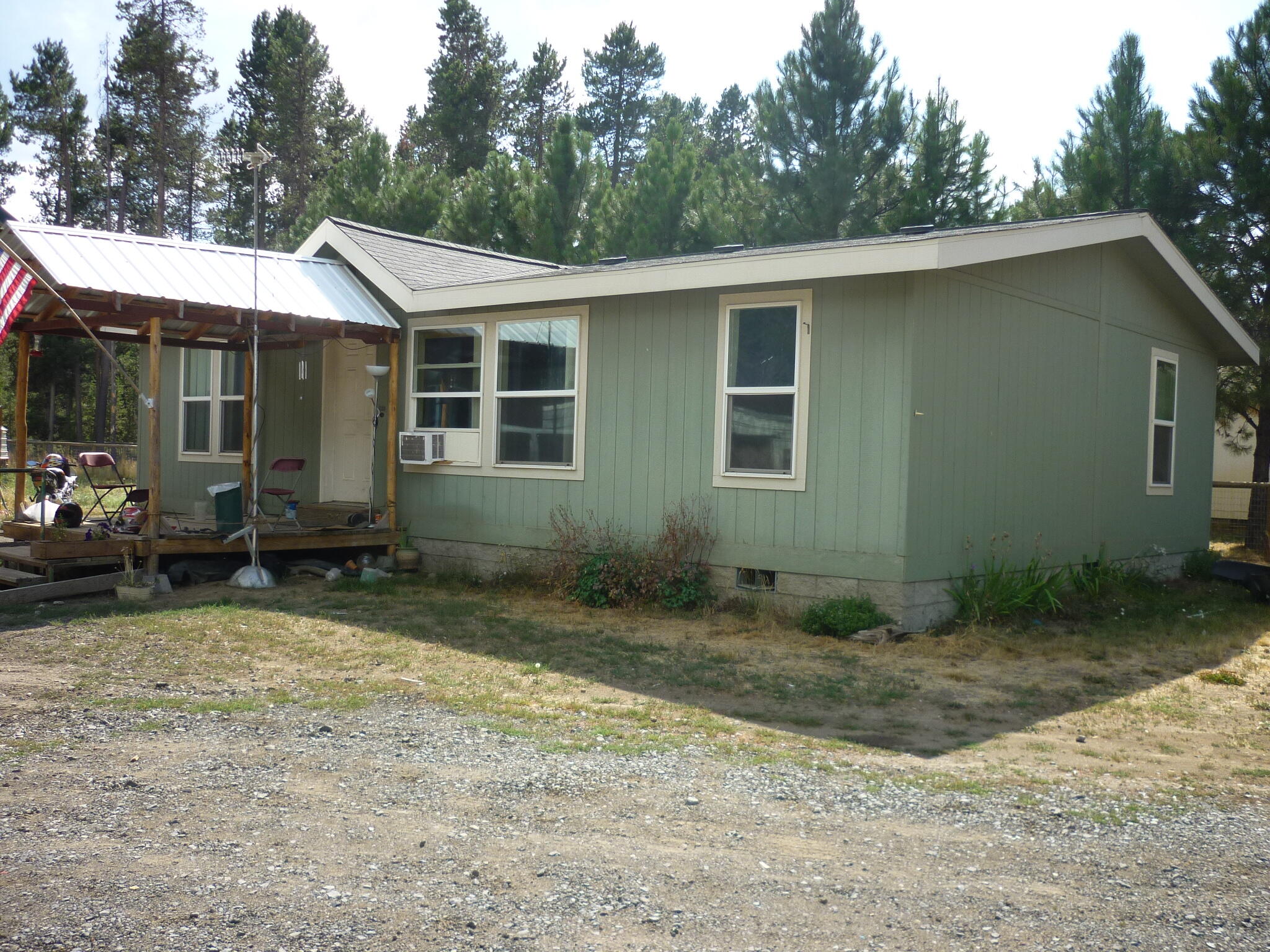 Home in good condition. Large area of Property is in yard and has underground irrigation. 870 sq foot shop with main shop door 13 x 13. Metal built R V cover measuring 12x12x30 feet. Property in road district.
