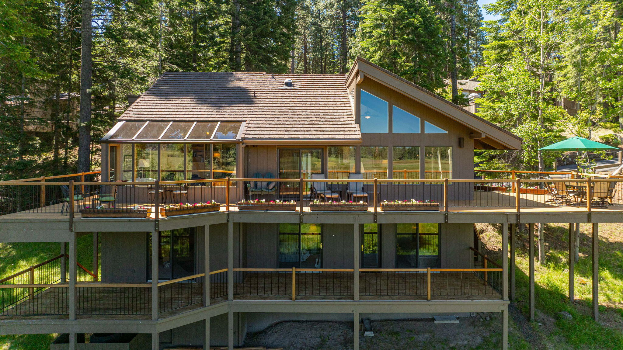 One of Black Butte Ranches premier lot locations. Situated amongst large Grand Fir trees, this home provides views of Three Fingered Jack, Mt. Jefferson and Black Butte. Enjoy complete privacy with common area space to the East, BBR Meadow to the North, open space to the West and just under 2000 square feet of decking to take it all in. This home was remodeled in 1997 by Paul Miller, and boasts, vaulted cedar ceilings, red oak hardwood floors, solid granite countertops in the kitchen and much more. All three bedrooms have their own  ensuite. Main level primary bedroom has large pane windows with views of Black Butte and Captain Jack's natural spring creek. Kitchen features stainless steel appliances and beautiful larch wood cabinets. Downstairs has large bonus room/office area and your own lap swimming pool. Deck on the second floor provides shaded views for the warms Summer days. This home has been meticulously maintained over the years and is ready for it next owner.