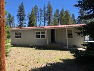 Recently surveyed, This level 1.43 acre lot has a 1983 2-bedroom 1.5 bath Liberty manufactured home that is of little or no value. The property, does have electricity, septic and well in place. Additionally included is metal detached garage/rv boat storage with a concrete floor, a shed and pump house are also on the property. A Great location off of a county-maintained, Paved road; Many outdoor areas nearby to explore! Come take a look and see if this is the property for you!