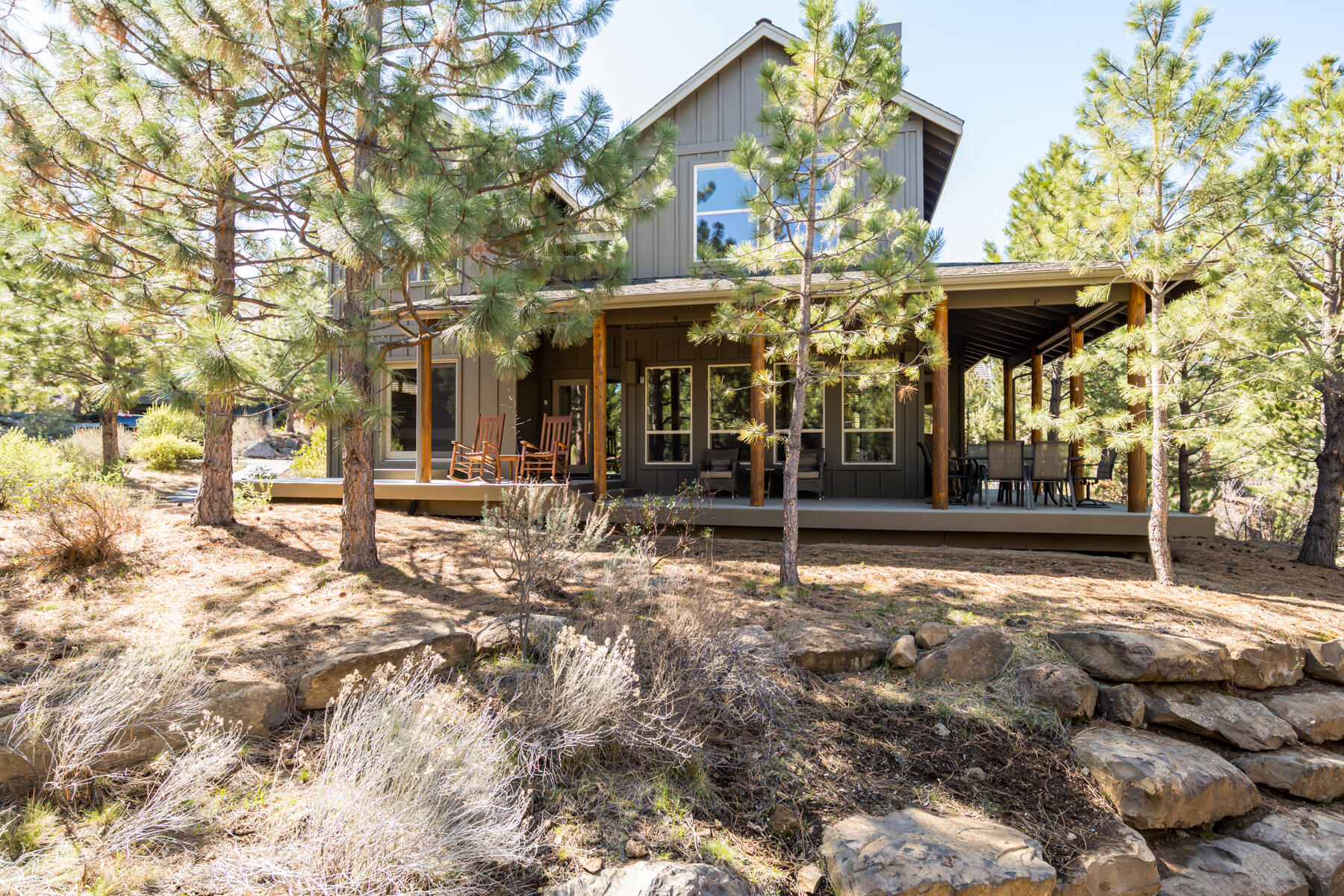 This updated private home in River Wild at Mt. Bachelor Village is perfect for a primary residence, second home or investment property.  Low maintenance, quiet living in a community with access to trails, the Deschutes River, a pool, clubhouse and hot tub area located on the way to Mt. Bachelor or just minutes from Bend's downtown, Old Mill District or all of the exciting restaurants and shopping popping up on the west side of Bend.  This home's open floor plan is great for entertaining and features a covered wrap around porch, a main level primary suite with 2 bedrooms and a bath on the upper level.  The kitchen was recently updated with quartz countertops, new stainless sink, and full height backsplash, the exterior was painted in 2020, and a private paver patio was completed in the back of the home.