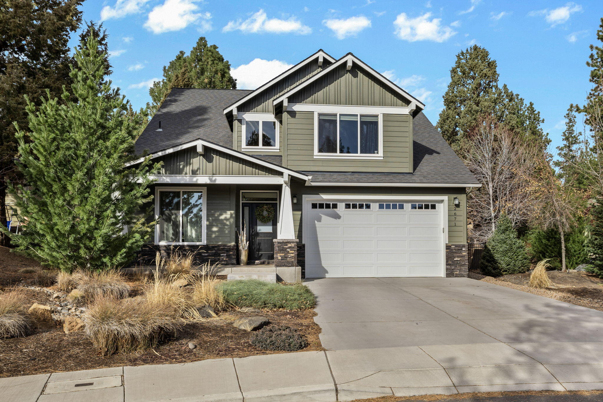 Nestled in a cul-de-sac in the desirable Shevlin Ridge neighborhood of NW Bend, this spacious 4-bedroom, 2.5-bath home is perfect for both comfort and entertaining. The open living floor plan flows effortlessly, highlighted by a stunning kitchen with solid slab quartz countertops and stainless steel appliances. A fourth room upstairs offers flexibility as a potential bedroom or bonus space while a home office or craft room downstairs is ideal for productivity. Set on a large 0.4-acre lot with an amazing backyard, enjoy ample space to relax by the fire pit or unwind in the hot tub.  The property also features a climate-controlled outbuilding, currently used as an office and home gym. With easy access to mountain biking, hiking trails and Shevlin Park, this is a true gem in a sought-after location!