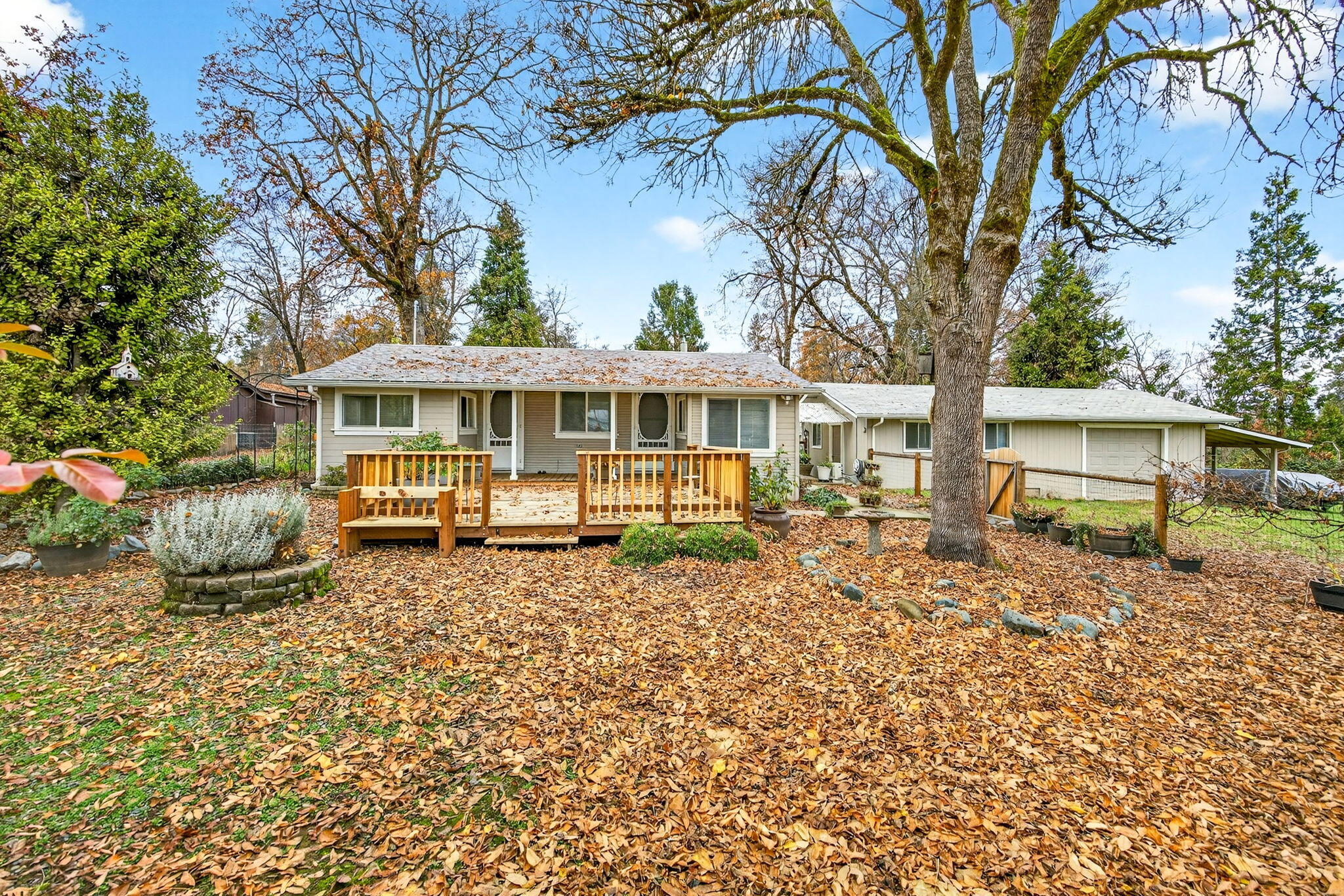 Updated and move-in ready! Tucked back off the street, this property offers two separate living spaces - the main 2-bedroom, 1-bath home plus a detached 800 sq ft garage with a finished bonus room, walk-in pantry and a permitted bathroom - perfect for guests, hobbies, or rental use. The .32-acre property includes a newer roof, deck, flooring, and septic, along with mini-splits in both buildings. Inside the main home, you'll enjoy a cozy pellet stove in the living room and two office/reading nooks for added flexibility. With fenced front and back yards, RV parking, plenty of outdoor space, and easy access to I-5, this property is full of opportunity.