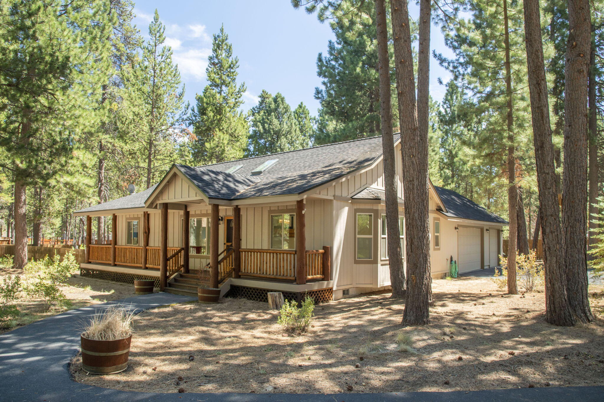 Tucked among the towering pines of Three Rivers, this single-level offers over an acre of elbow room and the kind of peace that makes you forget your inbox exists. With 1,601 sq ft of thoughtfully designed space, this home pulls off the rare combo of cozy and open thanks to vaulted ceilings, exposed beams, and fireplace insert that says, ''go ahead, light me.'' The primary suite enjoys its own wing of the house, giving ''quiet separation'' a whole new level of respect. The great room flows into an entertainer's dream deck big enough for BBQs, birthdays, or just birdwatching with your morning coffee. The fenced backyard is spacious enough to host a corgi Olympics or a garden that'll make your grandma proud. Bonus points for the shiny new tear-off roof, fresh interior paint (yep, even the garage), lush new carpet, new water heater and a DEQ-crushing septic test. Toss in a 3-car garage, and you've got storage for toys, tools, and whatever hobby you swore you'd pick back up this year!