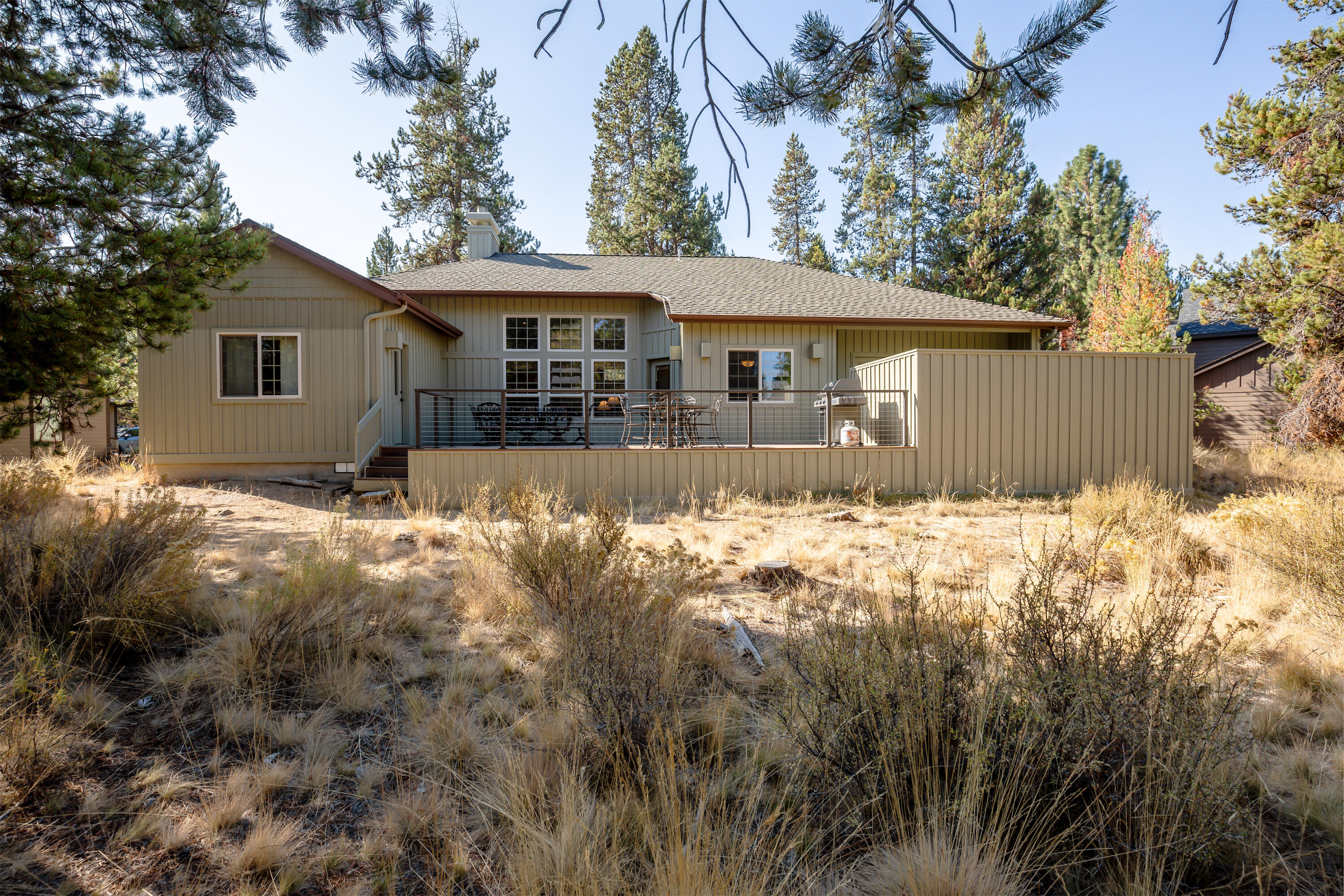 Beautiful single-level home in the heart of Sunriver. Featuring hardwood floors, soaring ceilings, and rich, knotty alder accents, this turnkey furnished home is impeccably maintained and ready to enjoy! Great separation of space with primary and Jr. suites, plus two guest bedrooms, formal dining and a generous great room. Air-conditioning and a gas fireplace will keep you comfortable indoors year-round, with a private hot tub and large deck backing to common space for outdoor living. Enjoy all Sunriver's amenities like tennis/pickle ball courts, Fort Rock Park, SHARC and the homeowners' only North Pool - all within minutes of your front door.  Start living your Sunriver dream!