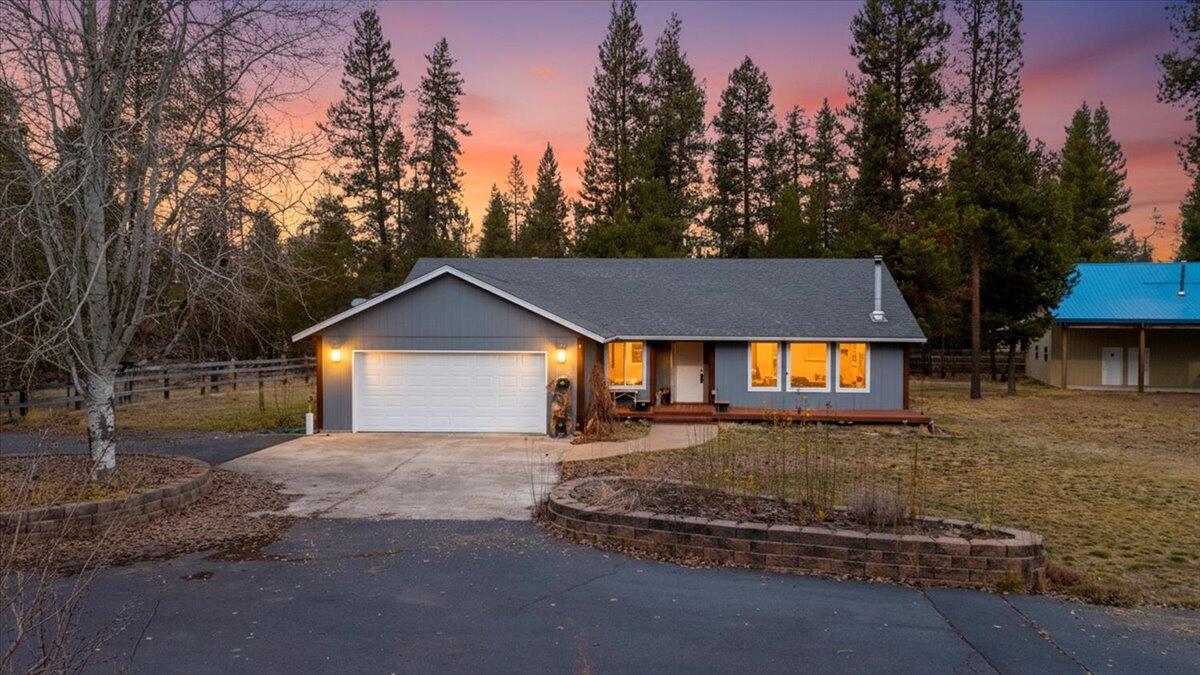 Just 3 miles from Quail Run Golf Course and minutes to public river access, this nearly 1-acre corner property offers space, privacy, and endless potential. The 1,920 sq ft single-level home features fresh exterior paint, new flooring and carpet, updated kitchen cabinets, whole-home water filtration, in-ground sprinklers, a heat-pump mini split, and a deck plumbed for a hot tub. The roof has heat tape for winter ease, and the attached garage includes built-ins and a dog door.

The standout feature is the shop space: a 1,728 sq ft shop with 200-amp power, metal roof, wood stove, ¾ bath, room + loft, and private gated parking—ideal for projects, workspace, or exploring buyer-verified ADU possibilities. A second 576 sq ft shop with concrete floor adds even more versatility. Fully fenced with no-climb fencing, this property blends quiet living with quick access to La Pine and outdoor recreation.