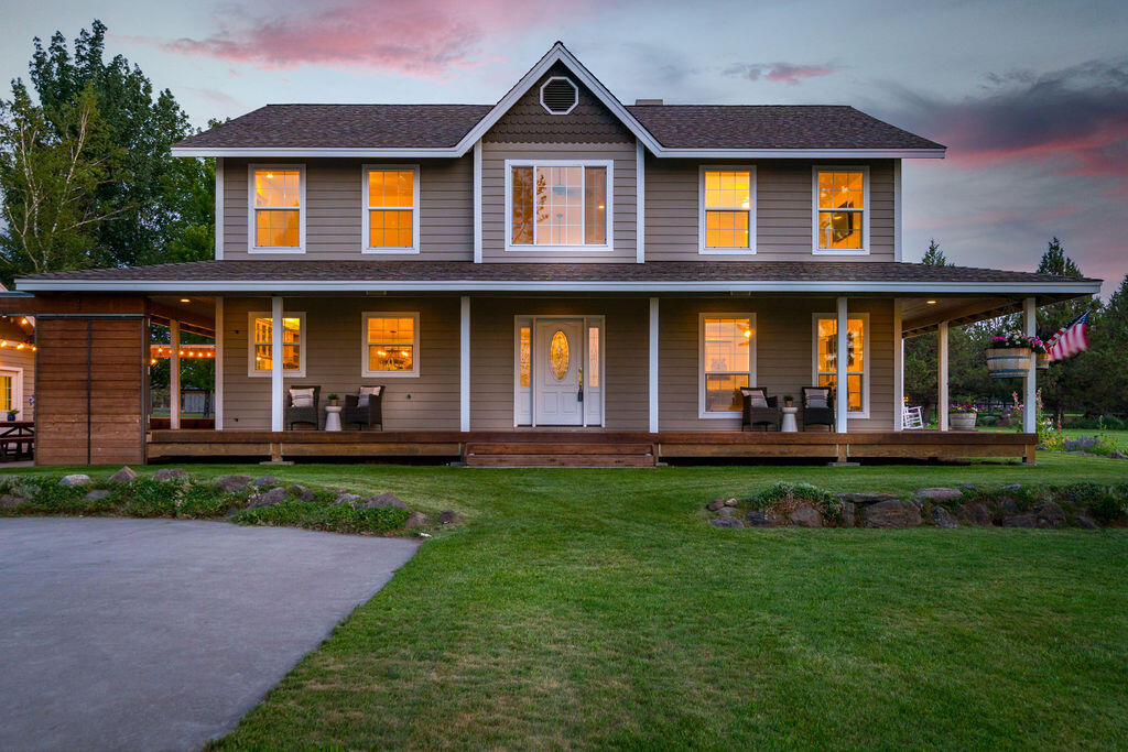This magical property is located just minutes from Bend in the highly sought after Tumalo area. Incredible farmhouse with wraparound porch overlooking 16.5 acres of beautiful land with it's own swimming pond.
This one owner home has been cared for impeccably.  Light and bright open great room plan with soaring ceilings.  Two primary suites featuring one on the main level.
Awesome, spacious & inviting kitchen with stainless steel appliances and double ovens.
Lovely sunroom overlooking the backyard and babbling creek water feature.
11.25 acres of irrigated pasture with in-ground sprinklers and a second pond for irrigation. 40x60 shop/barn as well as detached, oversized 3 car garage.
Incredible outdoor areas for entertaining, raised garden beds, greenhouse as well as apple, plum and pear trees!
You will feel the warmth and love of this home immediately.  A true legacy.