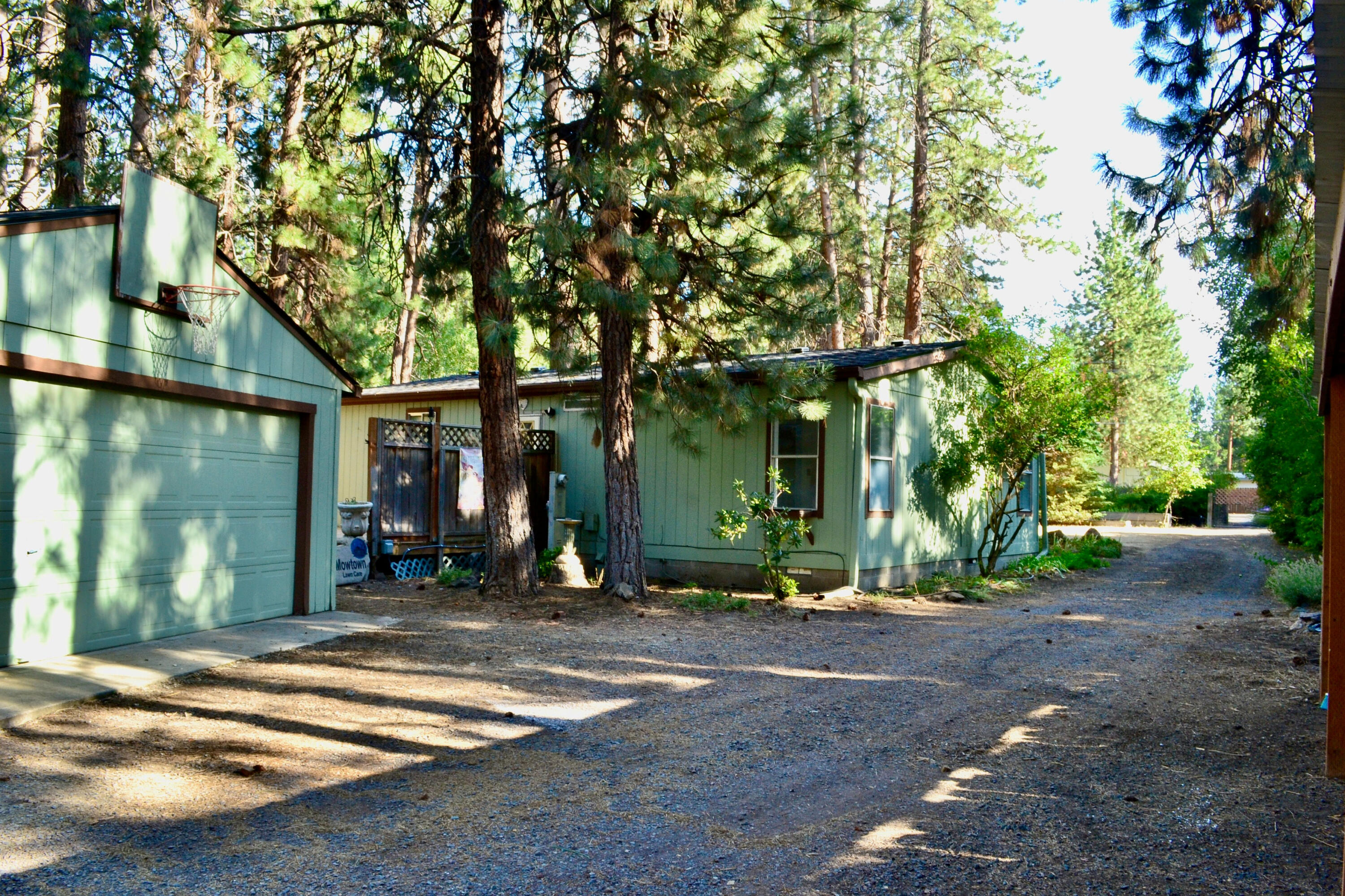 Welcome to this charming Bend retreat! This cozy home is perfectly situated on a large, private lot, offering the peace and tranquility you've been searching for. The location of Deschutes River Woods gives you the space you want, while being conveniently close to all that Bend has to offer.
Outside, the expansive lot provides ample space for all your toys, RV, boat, gardening, outdoor living etc. Multiple detached buildings, including a shop, greenhouse and more, add extra versatility perfect for hobbies and storage, 50amp Rv plug, wired for hot tub as well. This home also includes important upgrades, new flooring, paint and a new roof on both the home and shop!
Don't miss this rare opportunity to own a private, ready-to-enjoy home in one of Oregon's most sought-after areas!