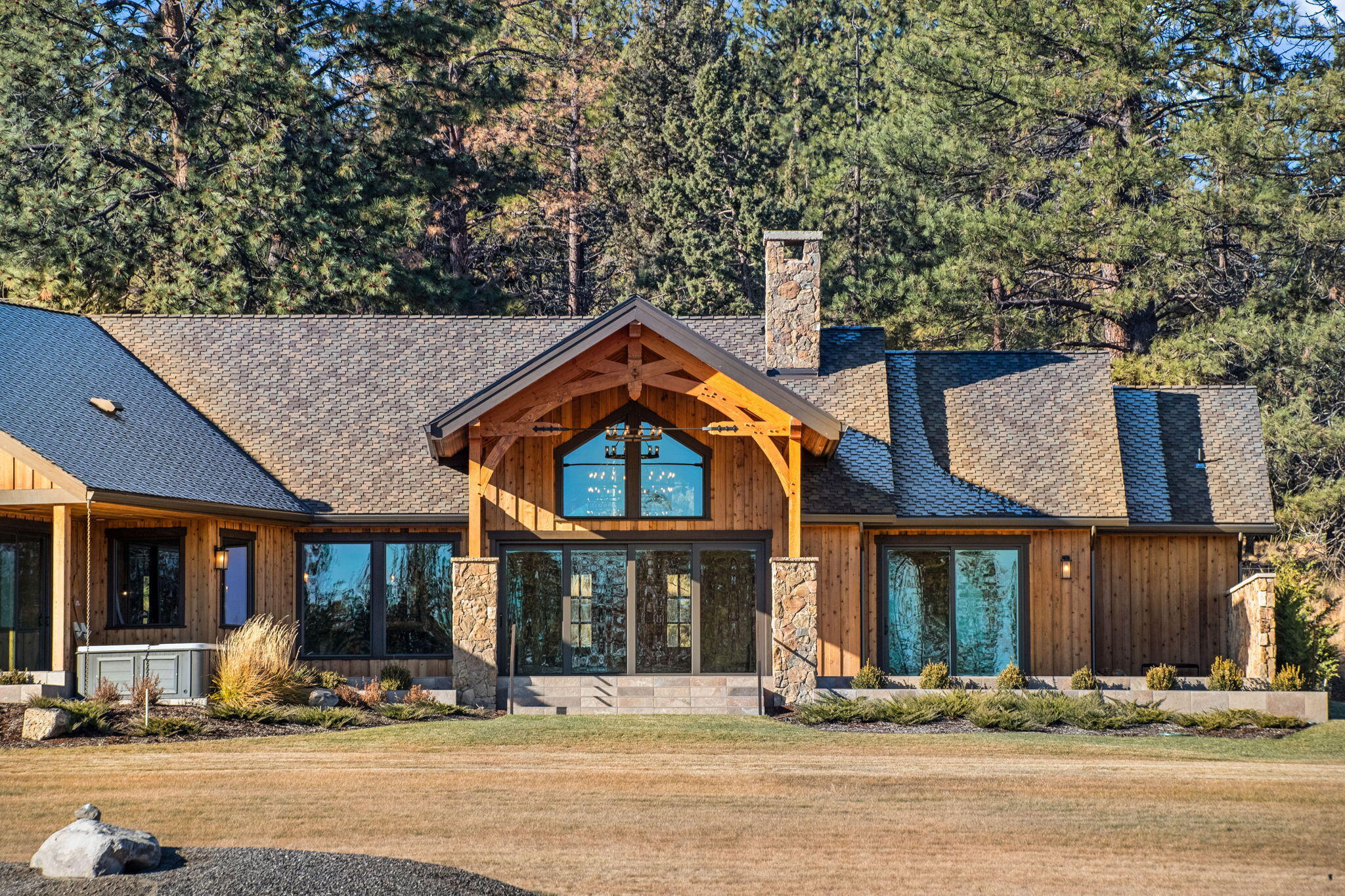 Welcome home to Tanager. Located on Bend's desirable west side situated on 182 acres and is Central Oregon's only boutique, waterfront residential community including 21 expansive homesites ranging from 1.32 to 10 acres. Each lot boasts frontage along one of the development's three water features - a regulation-size water ski lake, a recreational lake and Tumalo Creek. This 4,098 sf custom mountain modern home features 4 ensuite bedrooms, an open floor plan with tan oak flooring offering the most expansive views of the water with 16' of sliding glass doors. From the timber trusses sourced out of Montana to the burnt and brushed cypress wood ceiling there is nothing less than exceptional in this home. Entertaining is easy from the gourmet kitchen to the aged redwood slab bar countertop to the award winning best feature - outdoor living area from COBA Tour of Homes. Establish your legacy in Bend's premier lifestyle community and for a limited time can have exclusive boathouse storage.
