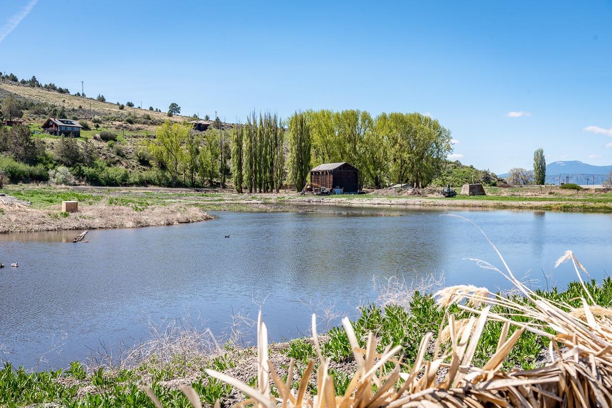Ever want to create your own Barndominium on waterfront property?   This Historical Barn is already in place on 23.47 Acres.  Barn is uniquely built with 2X6's stacked upon one another.  Private yet close to Klamath Falls.  Boasts great mule dear hunting and world class Rainbow trout fishing, Don't miss this opportunity own your own wetlands and be your own conservationist. Waterfront property with boat and dock access. There is access under Hwy 97, to explore the rest of Upper Klamath Lake as well . Large mule deer also are visitors and for the archery enthusiast, provide an extra bonus in the fall. There is a deep well, septic and power already for a much larger home. Unique and one of a kind property describes the Avey Outdoor Retreat! . Need to be prepped, have a place to grow and harvest your own food, look no further. Perfect getaway!!  Owner will carry with 50% down
