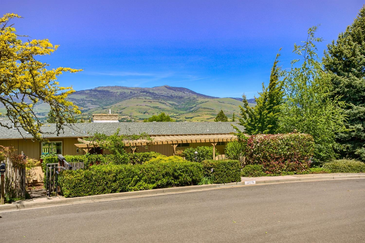 This above the boulevard home is filled with natural light and has the most incredible, panoramic views of Grizzly Peak. The vaulted great room features hardwood floors and lots of space. The kitchen is open, features newer countertops, lots of storage including a spacious pantry as well as hardwood floors. It has direct access to a side deck with great privacy. Tiled entry, main level master suite with private bath. Secondary bedroom and handicap accessible bathroom also on the main level. Two fireplaces. Lower level family room with wet bar and addtn'l bedroom. Expansive decks/balconies for outdoor entertaining. Inground gunite swimming pool with cover. Mature trees and shrubs lend to the incredible privacy in this home. There is a wine cellar located off the lower level patio.