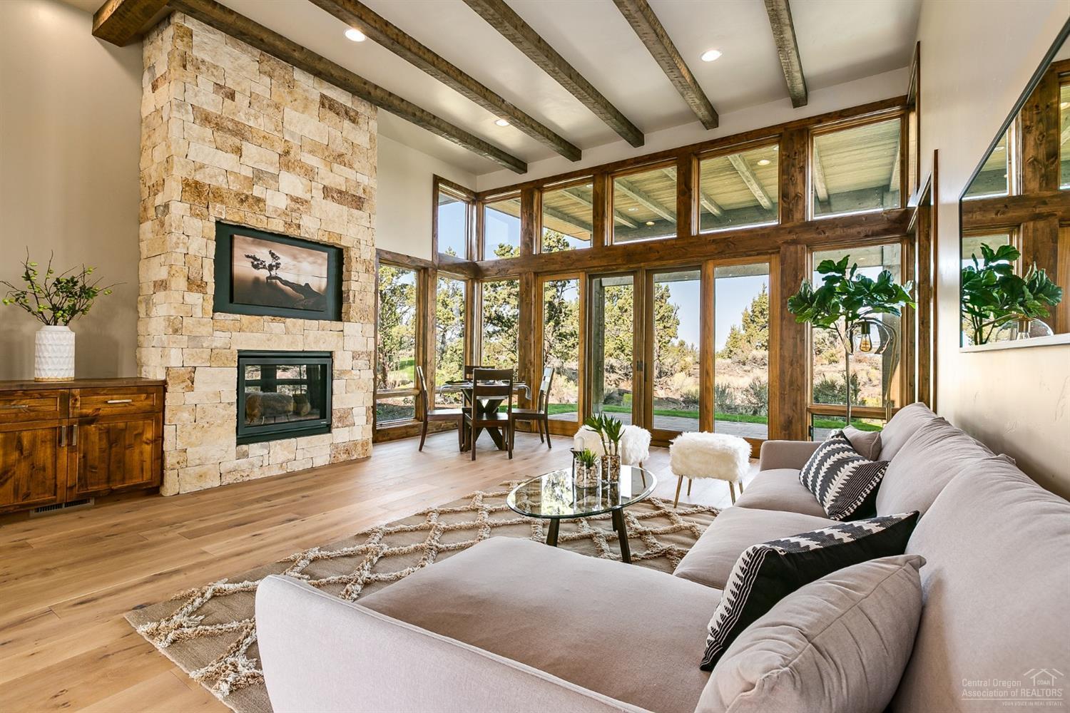 Tucked in and private, this Mountain Modern home designed by Wright Design, backs to the private Tom Fazio Course's 18th Fairway. This contemporary home offers upscale finishes throughout: High beamed ceilings, Glass doors open to a large paver patio, Full height Stone Fireplace, Quartz, tile and hardwood surfaces. An easy walk to all the amenities that Pronghorn has to offer! Nicklaus & Fazio Golf Courses ranked in Oregon Top 10, Private Member Club, 55,000 sq ft Club House, Pools & Fitness Center, Spa at Pronghorn, Fine and Casual Dining, Bike Trails, and more, You can also make this home a nightly vacation rental if you choose! Ask us about the Pronghorn Premier Club Membership!