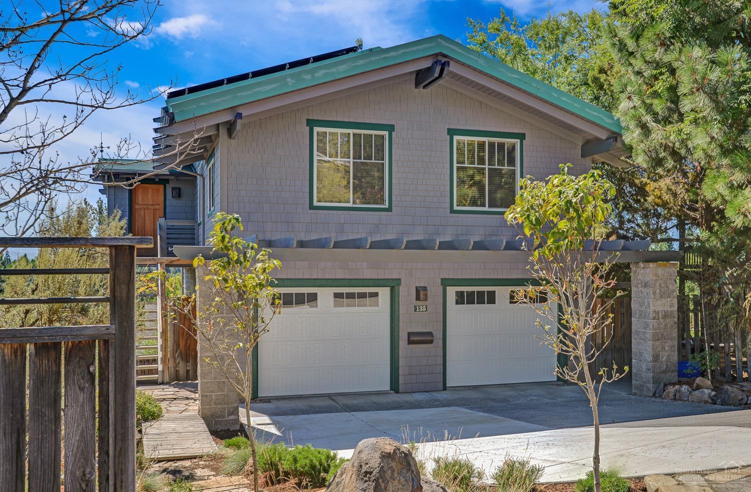 <b>Prime location + stunning views, large sq. footage, new updates and designer touches!</b> <br>Timeless architectural home w/vaulted Doug Fir ceilings and built ins everywhere. Gorgeous mud room entry leads to open great room featuring gas fireplace, kitchen island, and panoramic windows. Sliders out to deck offering a great place to lounge, entertain and take in the views of the river, Pilot Butte, and beyond. Past the kitchen is a huge walk-in pantry, XL bedroom, full bathroom and den (4th bedroom?). Master suite is on a floor all its own featuring wood ceilings, fireplace, built-ins and private deck!<b> Bottom floor can be a lockoff unit with separate entrance</b> and has living room, kitchenette, bedroom, and bathroom with sliders to landscaped yard and more parking. Adding to this are solar panels, storage galore, 2 laundry areas, oversize 2 car garage w/doors out to fenced in dog run! Steps to river trail and easy access to downtown, hwy, and all that the westside has to offer