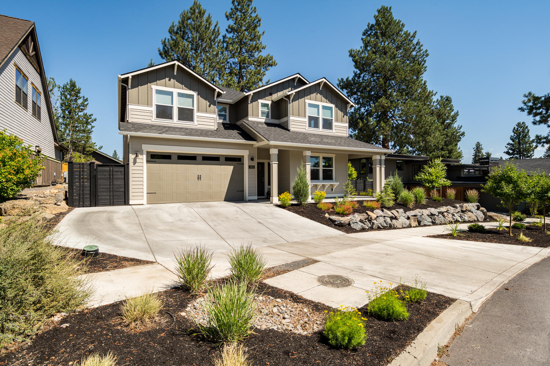 Prime NW location just around the corner from Discovery Park and a short walk to the shops at NW Crossing! Welcome to this incredibly spacious 3,007 +/- sq ft home built in 2020! The main level features one bedroom/office (French doors), full bathroom with tile shower, great room with gas fireplace, and your dream kitchen which includes GE Profile appliances, quartz counters (throughout home), beverage bar, and large pantry. Upstairs you will find a guest bedroom, guest bath, junior suite, loft, and the primary that boasts a soaking tub, separate shower, and walk-in closet. You will love how bright this home feels with numerous windows throughout! Outside is fully fenced and landscaped with sprinklers/drip and has a covered back patio and wraparound front porch. Additional features include dual zoned heating/cooling, 9 ft. ceilings on both levels, recirculating hot water, no HOA, and more! Short term rental permit showing eligible per City of Bend, buyer to verify.