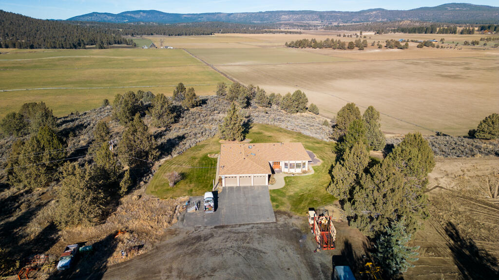 Seller Motivated!!  Come see this beautiful property with an irrigation well.  Remote with gorgeous views, custom 2934 SF 3 bed 2 bath home, 40 x 60 shop with a 4-bedroom 1 bath apartment w/kitchen and washer/dryer and wood stove.  Shop has diesel heater, bathroom and tons of storage.  Home and shop have newer roofs with warranty.  Property is fenced and cross fenced PLUS backs up to BLM.  3000 GPM irrigation well with 17-wheel lines- 307 acres of water rights, 130 acres of timber.  Located in Dairy, Oregon, East of Klamath Falls--- This is a property that checks a lot of boxes.  Farming, hunting, recreation, custom home & shop-- would make a purebred cattle ranch with room to feed bulls and calve out cows, grow hay & grain.  There are two domestic wells and several building sites with tremendous views.  Too many details to list them all- call to schedule your appointment!!