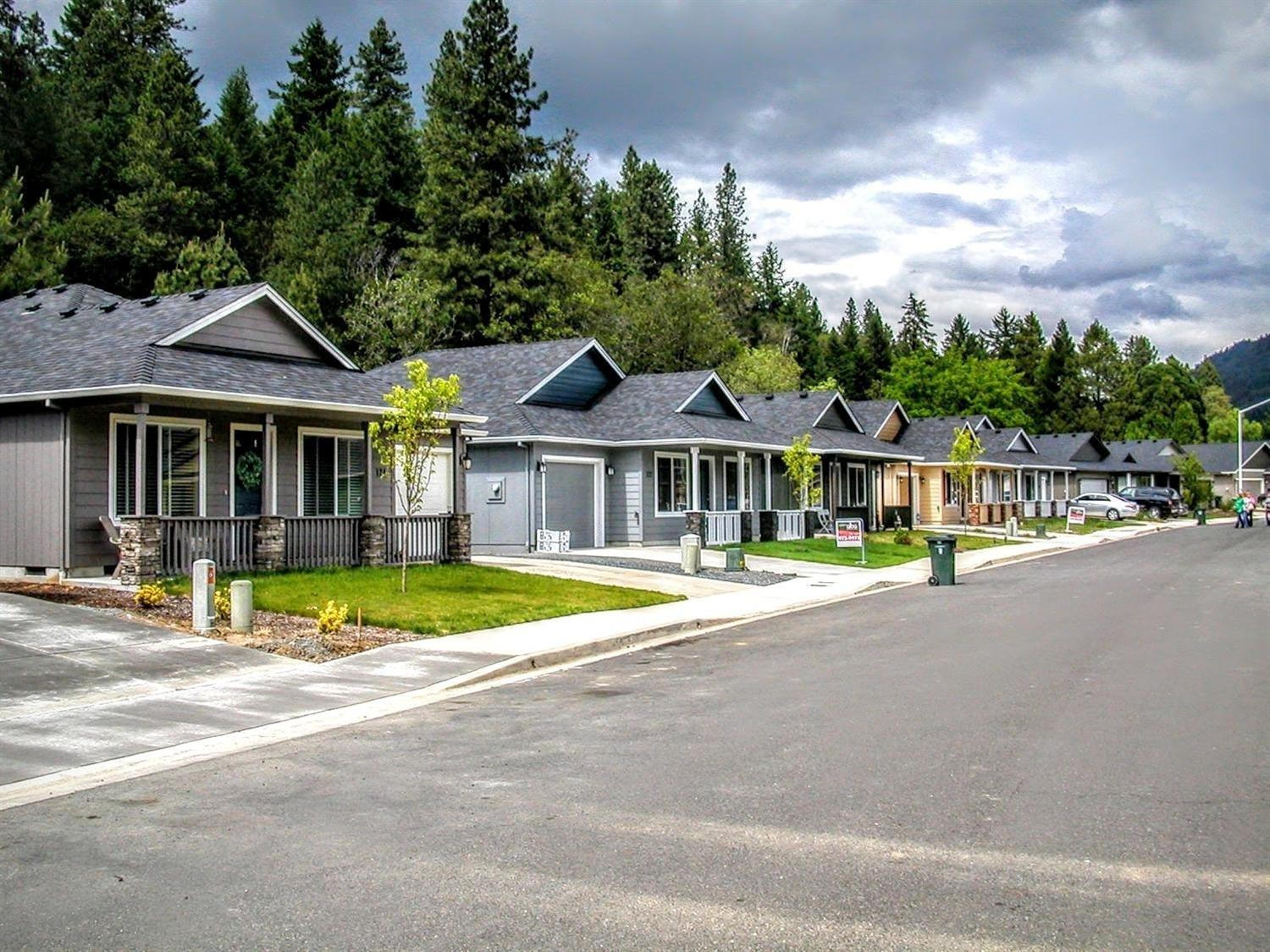 New construction in Rogue River: 3-bedroom/2-bath detached single-family home built by Lori Magel Homes, conveniently located 15 minutes from downtown Grants Pass and 25 minutes from downtown Medford. This single-story home features vaulted ceiling, 4-inch plank flooring and carpeting, full tile shower with listello in master bath, and ceramic tile flooring in both bathrooms and laundry. Kitchen features custom cabinets, granite counters, plank flooring, and upgraded stainless-steel appliances. The 2-car attached garage is fully finished and painted, with garage door opener. Vinyl fencing with gate for back and side yards included. Buyer can select colors, finishes, flooring, cabinets, counters, and options. Homeowners association to protect values with a monthly fee of $25.00. Move-in estimated 4/7/2017. Compare quality and value to any other new construction in Southern Oregon.
