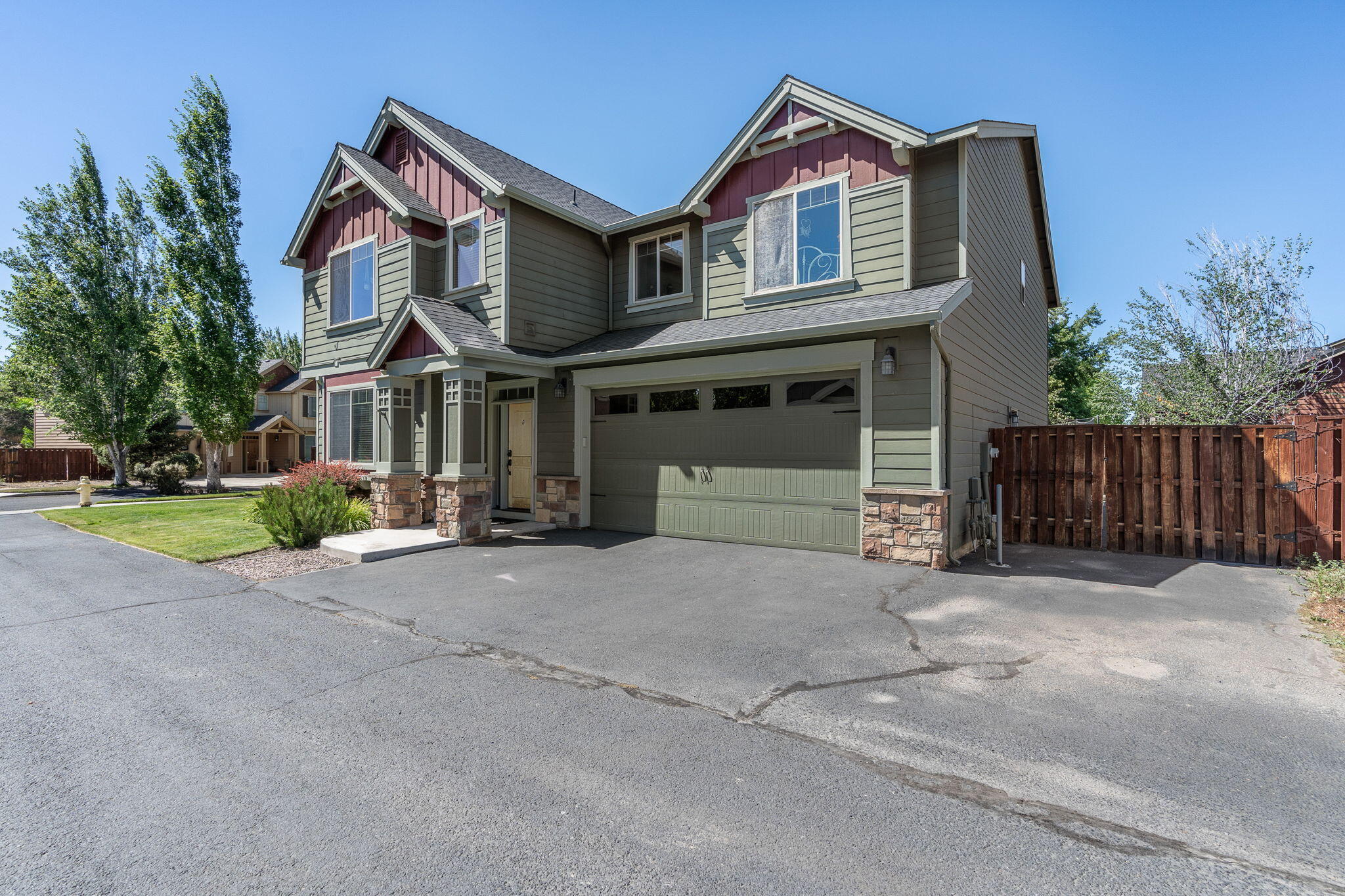 Impeccable, well maintained NW Redmond home in the desirable Fieldstone Crossing neighborhood boasts 4 bedrooms and 3 full bathrooms. Large open layout offers a bedroom/office and full bathroom on the main floor. Beautiful great room with vaulted ceilings and tons of natural light with cozy stone fireplace. Large kitchen with breakfast bar & pantry flows into informal dining room which overlooks expansive patio/backyard. Upstairs features 3 additional bedrooms and large bonus room/5th bedroom. Primary bedroom features a spacious en suite with amazing jetted tub, separate shower, and large closet. 3 car tandem garage has room for all your toys + storage! Nestled in the Fieldstone Crossing neighborhood, you'll have access to trails, playground, covered pavilion, and community pool! This well appointed .19 acres corner lot is fully landscaped with a fenced backyard and additional space for RV Parking.