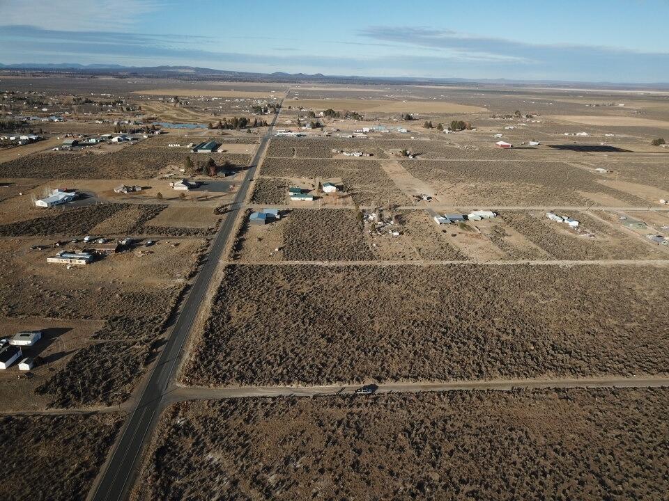 Buildable land for sale in Christmas Valley, Oregon - 1 acre with open views, near pavement, power, and fiber internet, plus close to town. This rectangular lot offers flat, usable ground and plenty of room for future building plans. Located just off Old Lake Rd, you'll have easy year-round access and quick travel into town for groceries, gas, and local services. The property provides flexible options, with power nearby and space suitable for a home, manufactured home, cabin, tiny house, shop, or potential RV use (buyer to verify with Lake County). Enjoy big skies, long views, and the quiet high-desert setting Christmas Valley is known for. Outdoor recreation is close by, including the Lost Forest, the Christmas Valley Sand Dunes, Crack-in-the-Ground, and Fort Rock State Park - offering hiking, riding, exploring, and exceptional stargazing throughout the year. A solid opportunity for buyers seeking affordable acreage, buildable land, or a future recreational base in Central Oregon!