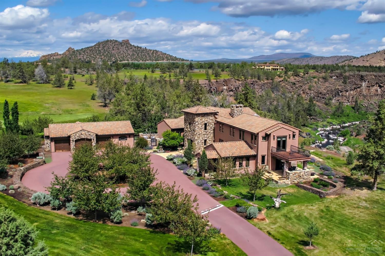 Ranch at the Canyons Tuscan Estate is a Private Retreat on 13 acres with Views of Crooked River, Monkey Face & Smith Rock. Custom home is exceptional quality throughout: 4527 sf 2 bedrooms, 4 bathrooms, stone accents, gourmet kitchen, granite counter tops, formal dining, breakfast nook, wood/tile floors, library, theater room (possible 3rd bedroom), wine cellar, patios, decks, 3 car garage with gear room. Ranch Amenities include: 1700 acres of meadows, farm, vineyard, river canyon, hiking/biking trails, picnic areas, river access, clubhouse with pool, stable, equestrian facility, arena, stocked ponds and Cascade Mountain Views.