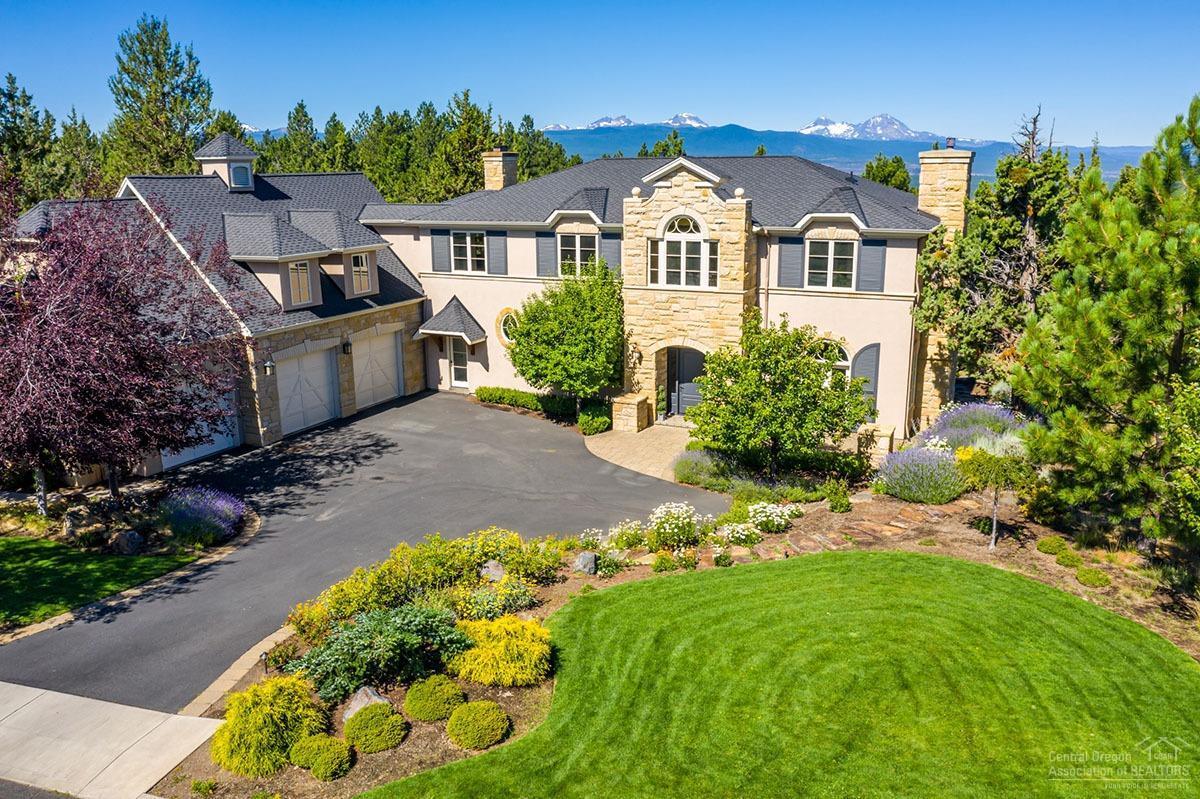 Traditional elegance & an architectural masterpiece overlooking glorious views of the Cascade Mountains! This charming custom home exudes quality craftsmanship throughout & offers privacy, peace & luxurious living on Awbrey Butte. Chef's kitchen features slab granite, large island, informal dining, an entertainer's dream butler's pantry & opens to a delightful family room w/wood burning fireplace. Gracious formal living room w/gas fp & French doors opening to front lavender-filled gardens. Spacious dining room features French doors allowing access to the back deck...an exquisite outdoor entertaining space with mountain views, expansive flat backyard, hot tub & outdoor shower. Main level office. Upstairs offers private Master Suite with STUNNING views, dual vanity, soaking tub & tiled shower. 4 additional bedrooms (1 en suite), 3 full baths, bonus room & separate workout/flex space also upstairs. Large 3 car garage. Close proximity to all Westside schools & amenities. A phenomenal home!