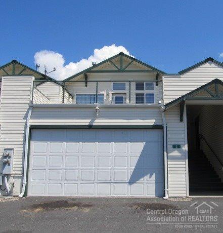 Priced to Sell! This Townhome at Boulder Brook features 2 beds, 2.5 baths, reverse living floor plan, vaulted ceilings, large master bedroom/master bath, gas fireplace, large deck over the garage with small storage shed, smaller deck off dining area, concrete patio off master, attached double car garage. Convenient location and priced to sell! HOA covers water/sewer, exterior maintenance and landscaping.