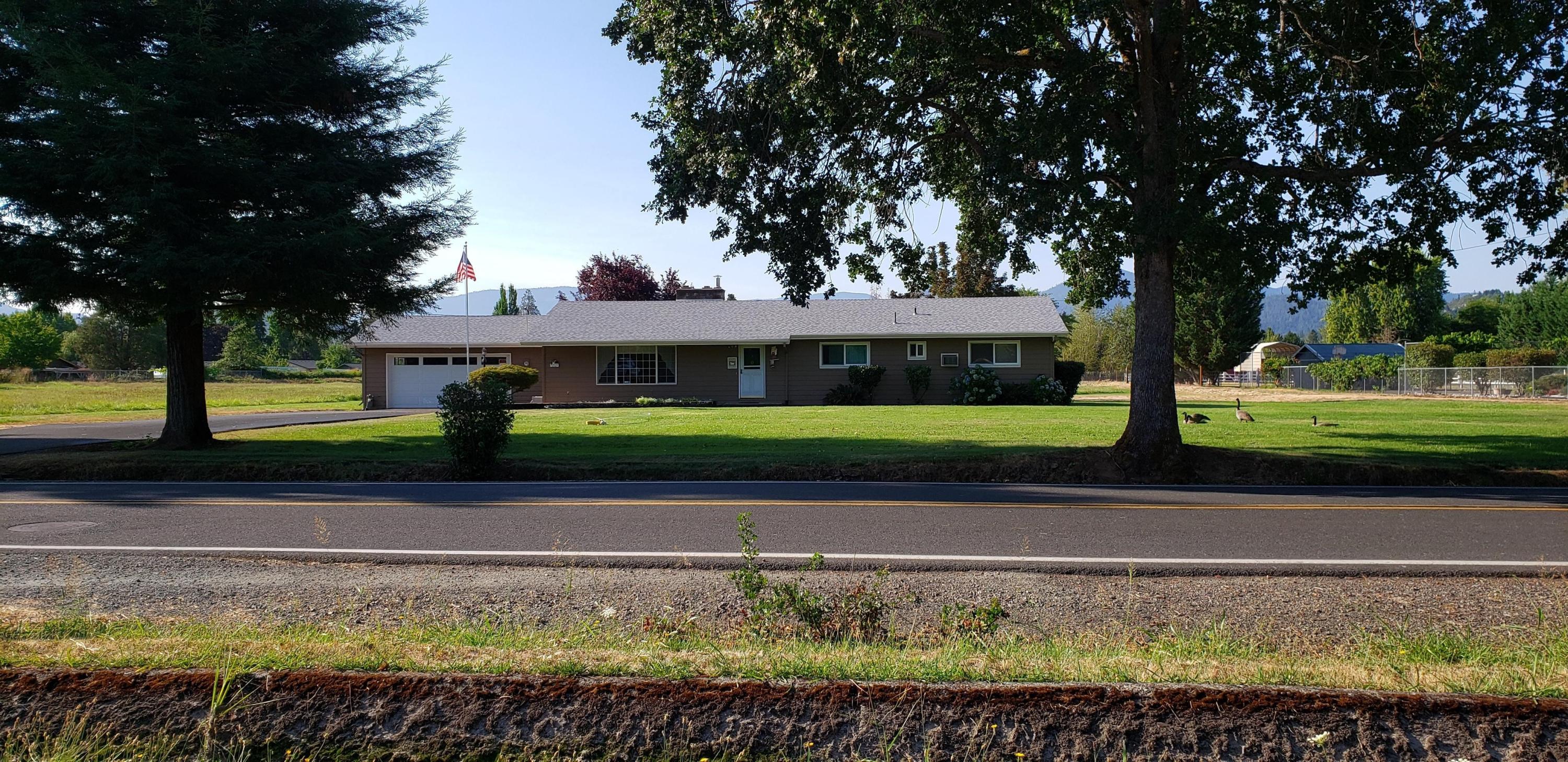 Great family home with room to roam on its 2 acres, plus the adjacent 2 acre parcel is available at this time. (Zoned RR-1!) The one level, 4 bedroom, 2 bath home sits towards the front of the parcel, so lends itself to all kinds of possibilities.