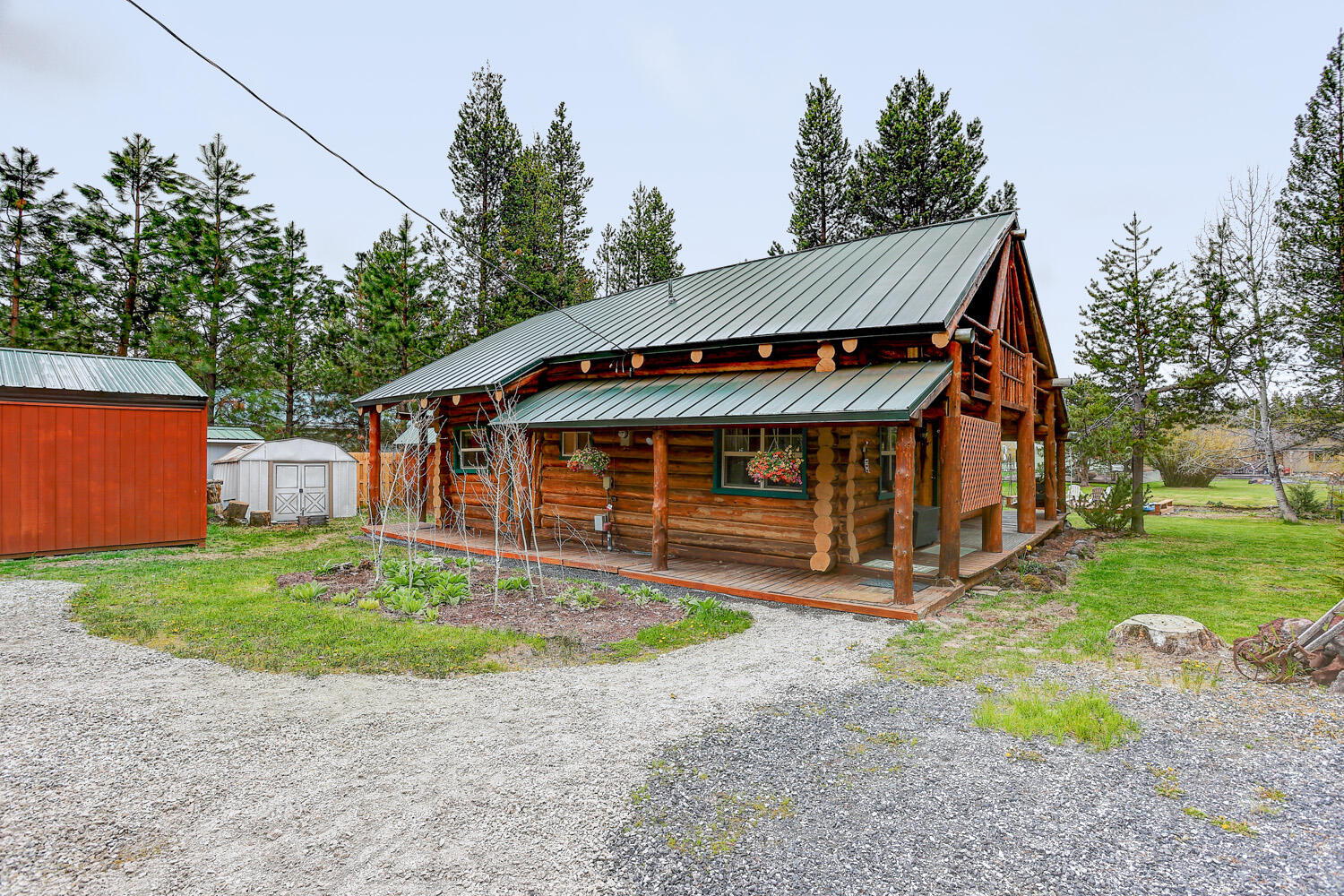 Waterfront original log home w/ your own private dock on the Big Deschutes River canal! Sitting on 0.43 acres this adorable cabin is the perfect retreat. Vaulted ceilings allow for tons of light with plenty of room to entertain all while enjoying the wood burning stove that will give you all the cozy vibes during the cold winter months. Two bedrooms & full bath on the main floor allow for privacy as well as large loft that can easily be used as a 3rd or 4th bedroom. Enjoy your morning coffee on the private balcony or on your own private dock right on the channel. The detached two car carport will protect your vehicles from the snow, plus there are multiple outbuildings to store your toys as well as plenty of room for RV/boat parking! Community water and sewer. Short term rentals allowed. Conveniently located near Sunriver resort, Mount Bachelor, and the Cascade Lakes .