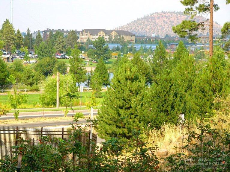 Great opportunity to buy & build in one of Bend's Best Kept Secrets! Elevated location allows desirable Deschutes River views/close to Deschutes River Trail, Farewell Bend Park & Old Mill shops. Enjoy privacy + the beautiful Deschutes without Reed Mkt. frontage! Great location for hiking, biking, floating the river & easy access to the Parkway. Lot allows access from back & rear of yard w/mature fruit trees on rear of property. Great opportunity for builder looking for ideal location! Could be great rental!