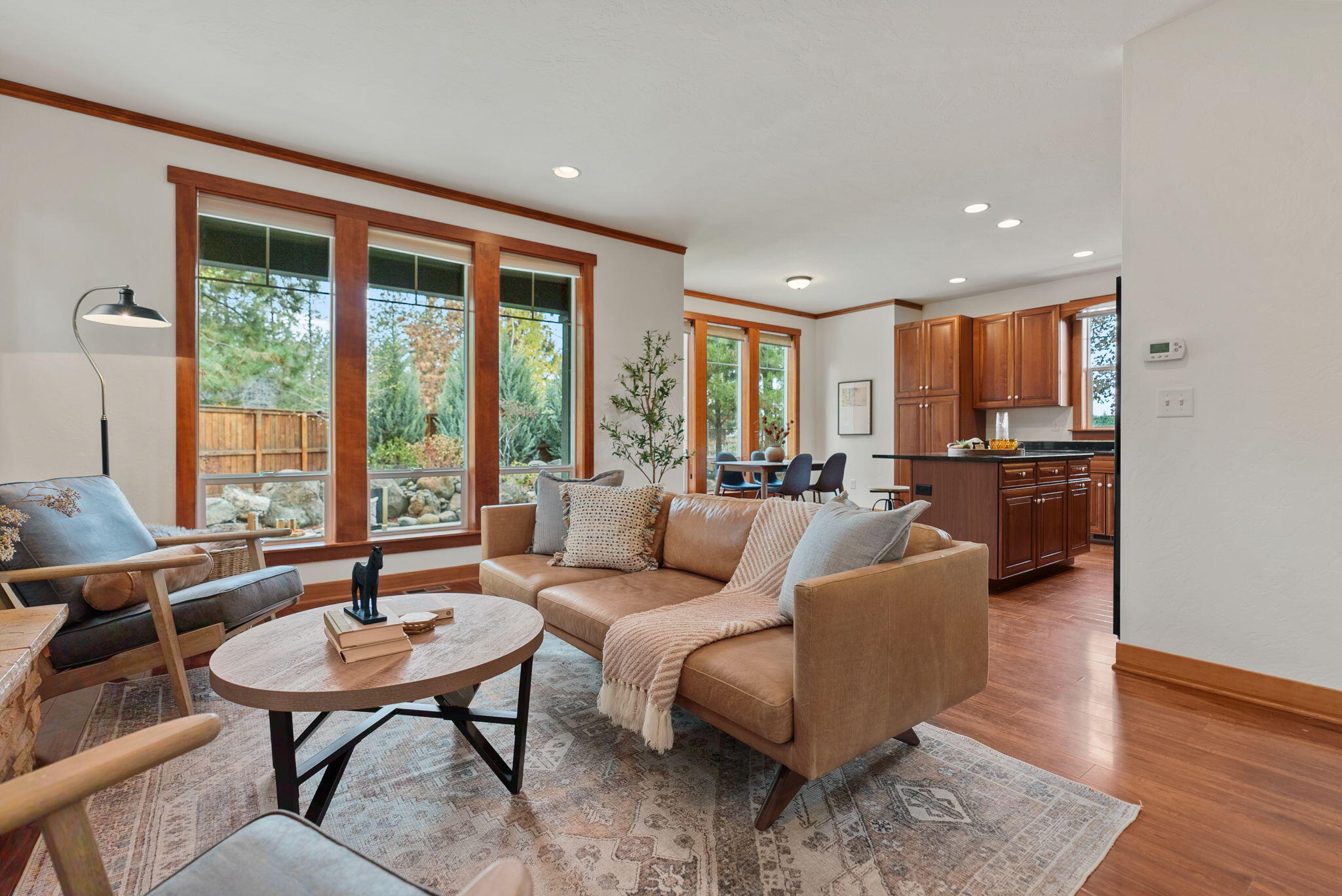 Reduced $60,100 to $564,900, close by 12/29/2025. 1,635 SF home on an oversized 0.32-acre, in-town lot offers a move-in-ready option for those looking to put down roots in Sisters! Next to Sisters' newest park, feat. pickleball, basketball, baseball, gazebo/picnic area. This home lives larger than its square footage with tall ceilings, abundant natural light, 3 beds, 2.5 baths, loft, and Great Room with a propane fireplace. The kitchen has an island, breakfast bar, custom soft-close cabinets, pantry cupboard, and granite counters. The main level opens to a private fenced yard with a covered patio and large windows overlooking mature trees. Upstairs, a versatile loft provides space for work, play, or hobbies. Room for your RV, boat, or work truck, plus a 180 SF shed/playhouse, raised garden beds, oversized two-car garage, AND parking for 4+ autos. Central AC and heat, city utilities, and a stellar location near Whychus Creek trails and downtown Sisters. Live the Sisters' life and vibe!