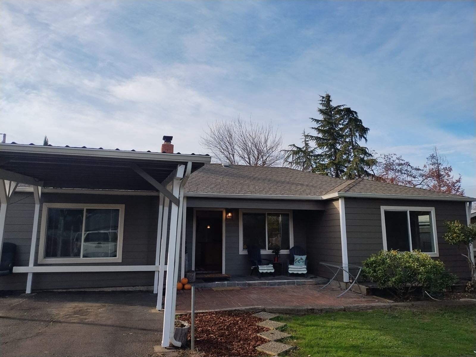 Here it is, lovely single level upgraded, updated home in desirable East Medford neighborhood! You are literally minutes from all the best amenities in Southern Oregon!! Head N for dining, retail, gym and the mountain lakes of the Pacific NW! South you're headed to the stunning Rogue Valley Country Club for some recreation or Roxy Ann winery for a lovely glass of SO's finest, try taking the back country road to Ashland for some Shakespeare! Just minutes from indoor Pickleball! You'll love to enjoy your morning coffee on your covered porch while taking in the sunrise over Roxy Ann mountain! The floor plan for this 4 bd even includes a bonus room! Granite throughout, cozy real fireplace for warm days of reading fireside! Backyard has two wonderful storage outbuildings.  Lovely setting for backyard bbq's, lots of room for parking and turn around, plenty of room for a garage or workshop!  Truly lovely home in a lovely location!! Charming and cozy with lots of beautiful alcoves and arches!