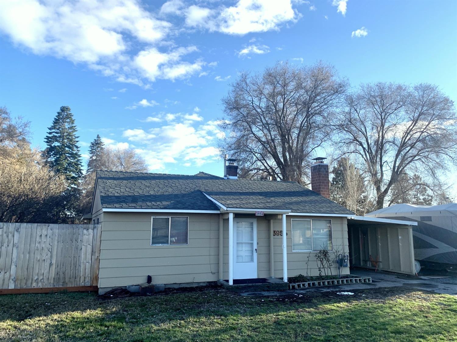South suburbs! This cozy home features three bedrooms and two bathrooms (including master with en suite) on a large, fenced, 0.23 acre lot located on a quiet, not-through street. There is a carport and RV parking - no need to pay storage fees! House should qualify for most loans.