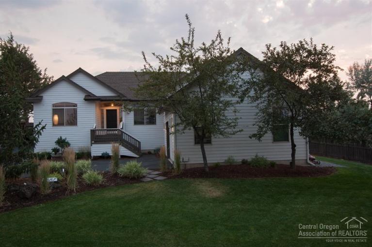 Beautiful landscaped home on oversized, elevated private corner lot. Backyard fenced with view of the Cascade Mountains. Back yard has fire pit area which is inviting. RV parking on side of home. Home has a great room with skylight, dinning area, and the kitchen has new appls(within last year). Great separation of master suite and the other two bedrooms. Separate office off the Great Room. Home has new interior paint and vinyl in the laundry room. Call to see this home, in a nice north-east neighborhood