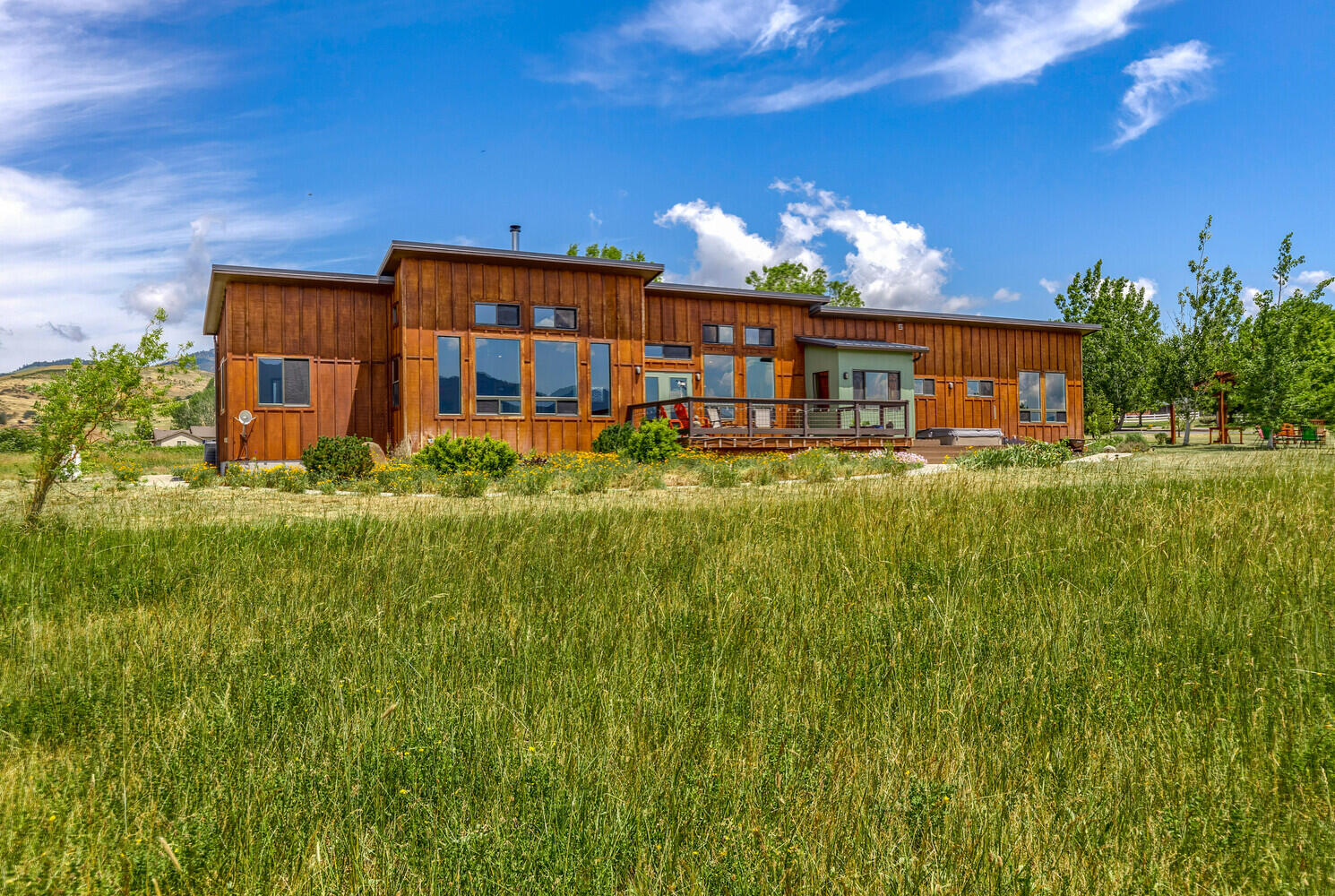 Come experience this magical property for yourself! Located just minutes to downtown Ashland, this pastoral 10 acre parcel boasts some of the best views around! Enjoy 360 degree views of Pompadour Bluff, Pilot Rock, Grizzly Peak and a stunning view of Mount Ashland and the quaint town of Ashland. Marvel at the ever changing skies with rich, blue backgrounds, dramatic white clouds and pink sunsets in the evenings. The main home was planned with all these views in mind and completed in 2009. It features a modern, single level design with clearstory rooflines and tall windows, framing the views magnificently. The warm living room includes a Danish wood burning stove. The primary suite has dual vanities, a large two-person tiled shower and a spacious closet. The opposite wing features a bedroom, an office and a north-facing, light filled art studio. In addition, there is a detached 587 SF studio with an enclosed office featuring the same fabulous views. Don't miss out on this opportunity!