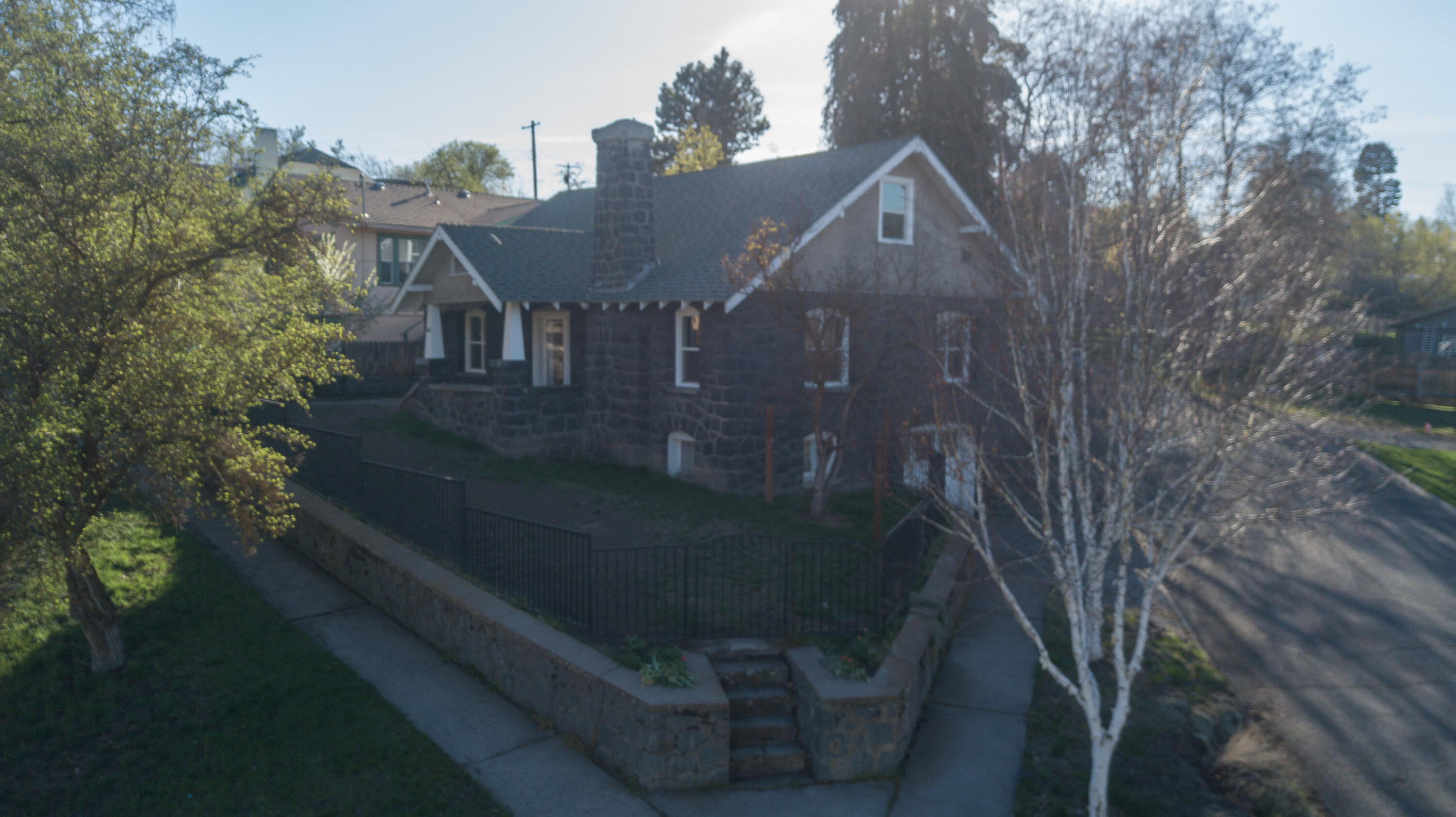 Cute and ready to move in.  3 Bedroom 2 bath home with extra parking plus garage and shop space below.  Covered front porch, coved ceilings, hardwood and new carpet, fully fenced.  Easy to show.  Come find out if this is the home you have been waiting for.
