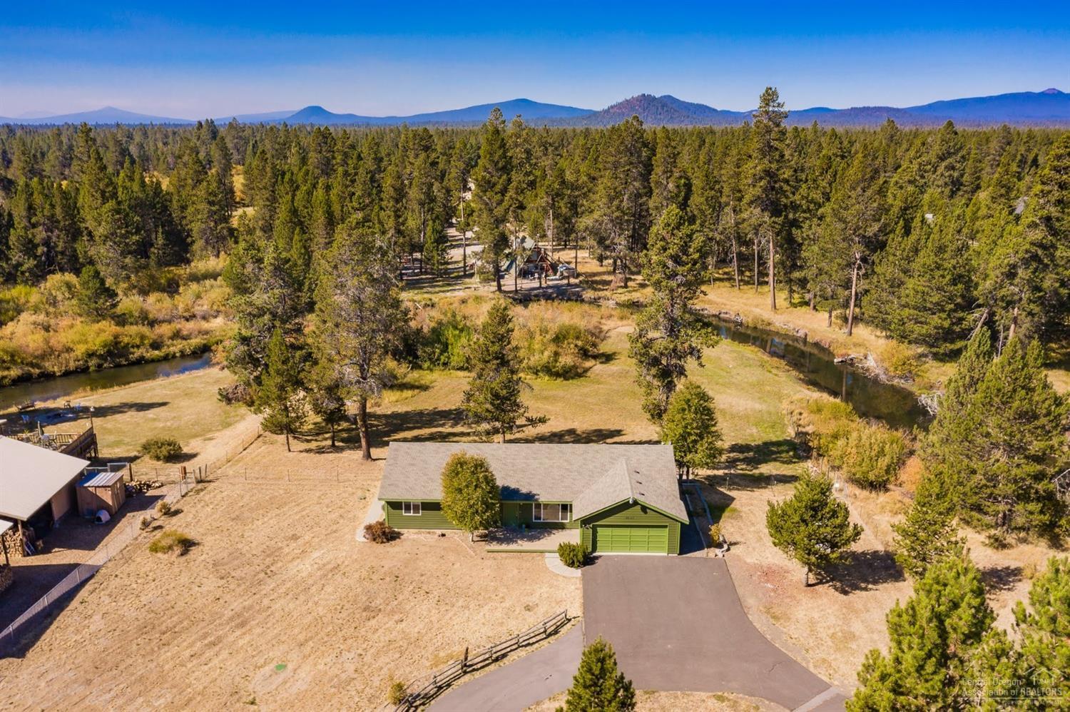 Little Deschutes River Frontage 3 bedroom/ 2 bath single level home on 2 acres! Enjoy this quiet and tranquil location in an amazing setting. Room for your RV, toys, animals, and a possible shop. Well cared for home with updates including interior/exterior paint, new decks, new flooring, new bathroom vanities & tile. Easily accessible location approximately 5 miles south of Sunriver. Home sits well away from the road and accessed by paved circular driveway. Come and bring your fishing poles, paddleboards, or just enjoy sitting on your adirondack chairs taking in the sights and sounds of wildlife, sunrises/sunsets, and the beautiful natural setting. This home awaits your personal touches and a Central Oregon lifestyle away from the hustle and bustle.
