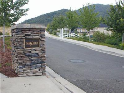 Rare 1.80 (+/-) acre estate homesite at the end of a private drive. This gentle sloping lot is located above Strawberry Meadows & offers seclusion & privacy. This lot is located in an area of very expensive custom homes & has a phenomenal view of the mountains & valley below. Price includes shared ownership in the tennis court built for the subdivision owners. Close to downtown Ashland, Lithia Park, walking & hiking trails. A very special property.