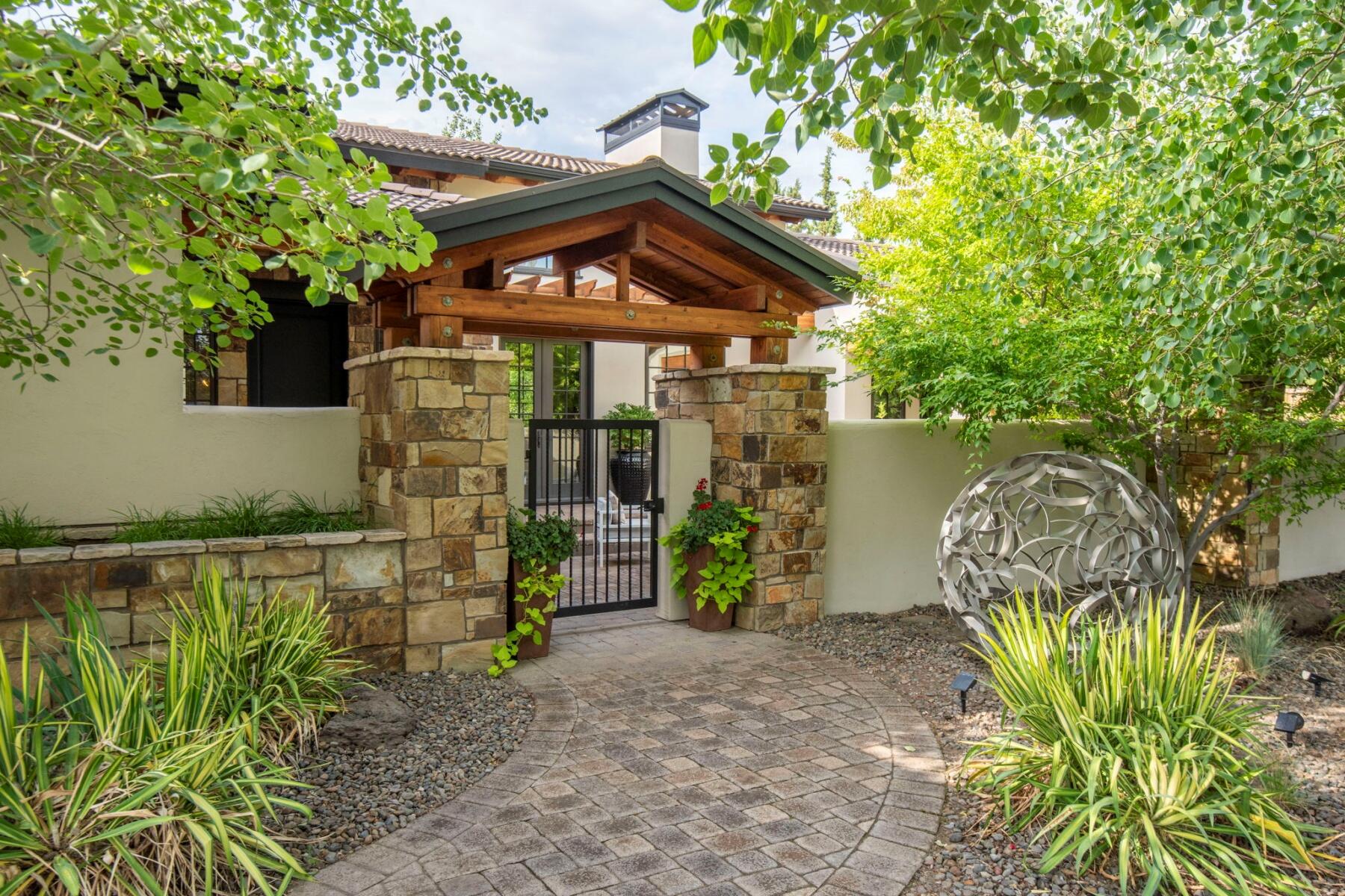 This a rare opportunity to own a recently updated custom home in the Estates at Pronghorn, in a private environment surrounded by mature landscaping. The property boasts six outdoor areas, including one featuring a wood-burning fireplace and another with a fire pit. Upon entering this exquisitely constructed residence, you are greeted by a spacious, light-filled great room adorned with high ceilings, wood beams, solid wood-trimmed windows, and a cozy wood-burning fireplace that fosters an elegant yet warm atmosphere. The thoughtful design emphasizes primarily main-level living, offering separated bedrooms, including a private guest casita off the courtyard, ideal for hosting family and friends. Take advantage of athletic facilities, pools, pickleball courts, and renowned Pronghorn Golf courses, or a leisurely walk to the nearby dog park. With the generational membership included (valued at $115,000.), this is an exceptional home to create lasting memories.