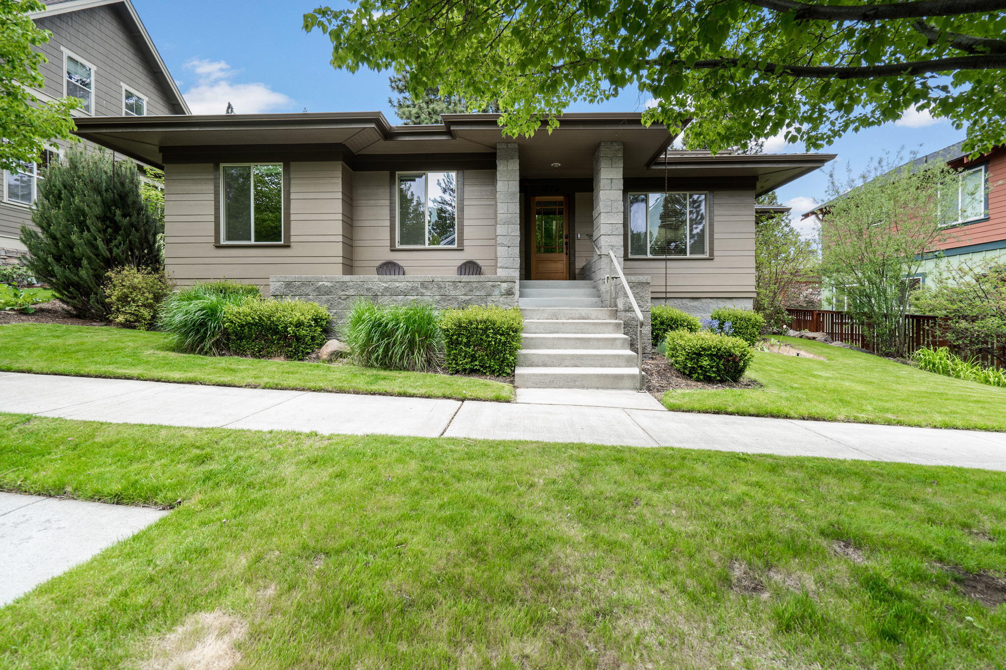 Welcome to Northwest Crossing!  This well-designed home with 2 primary suites is nestled in the center of all things Bend with walking distance to restaurants, parks/dog parks, schools, walking/hiking trails, local farmers market and so much more.  It's a 4-bed, 3-bath home that offers 2378 square feet of comfortable living space with an open kitchen, an eating bar, and a separate laundry/utility room with a sink.  A 2-story open floor plan with a primary suite on the main floor and another primary suite with a 2nd generous sized living area upstairs.  Enjoy barbecues and entertaining in your large, fenced backyard with natural landscaping and several paved areas for sitting, one is even pre-wired for your hot tub.  The oversized, 2 car garage has an extra room for storage as well as built-in cabinets.