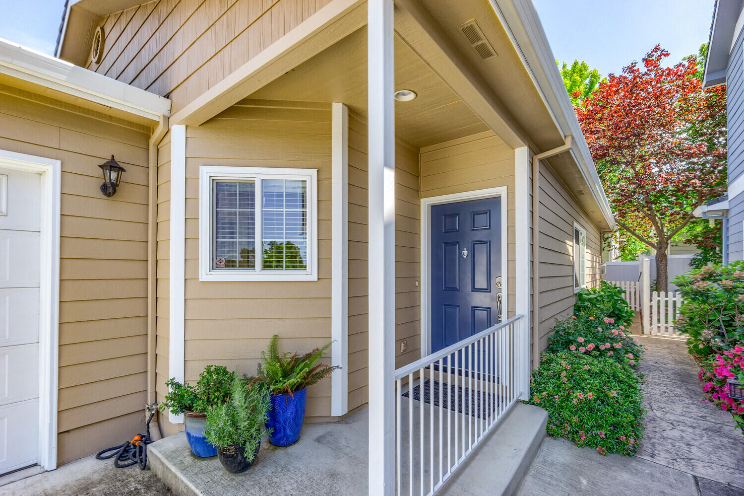 This beautiful 2 bedroom, 2 bath single-level garden home is in a great location on a quiet street close to shopping and the YMCA.  It features 9-foot ceilings, a gas fireplace in the living room and a slider to a small fenced garden patio. There is a spacious kitchen with pantry and a light and bright primary bedroom with ensuite bathroom. The second bedroom has an adjoining alcove which can be used as office space. There is a second full bath and full laundry room. Skylights in kitchen and guest bath and solar tube in office-alcove provide lots of natural light. This is a perfect starter home, vacation home or for the retiree wanting to downsize. The two car garage rounds out the features. Upgrades since 2020 include exterior painting, white oak flooring, interior painting and lighting, new fridge, updated primary shower and tile floors in both bathrooms. All appliances, curtain rods and freezer in the garage are included in the sale. This home is turnkey and ready to go!