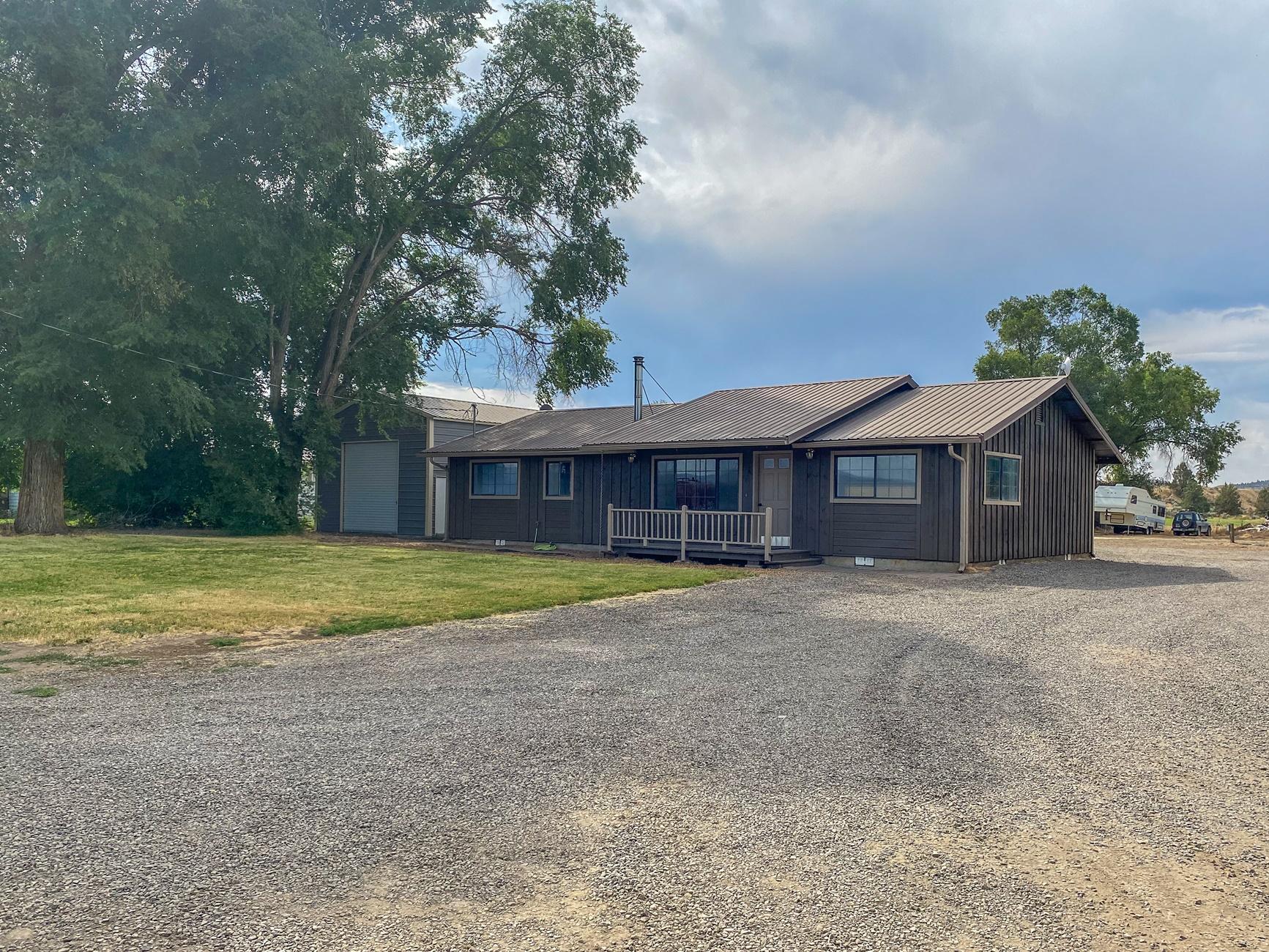 Updated home on .64 acres with shop and plenty of parking for all of your toys. New interior and exterior paint, updated kitchen with stainless steel appliances, new flooring, split floor plan and nice covered back patio. Shop has roll up doors at both ends for pull through access.