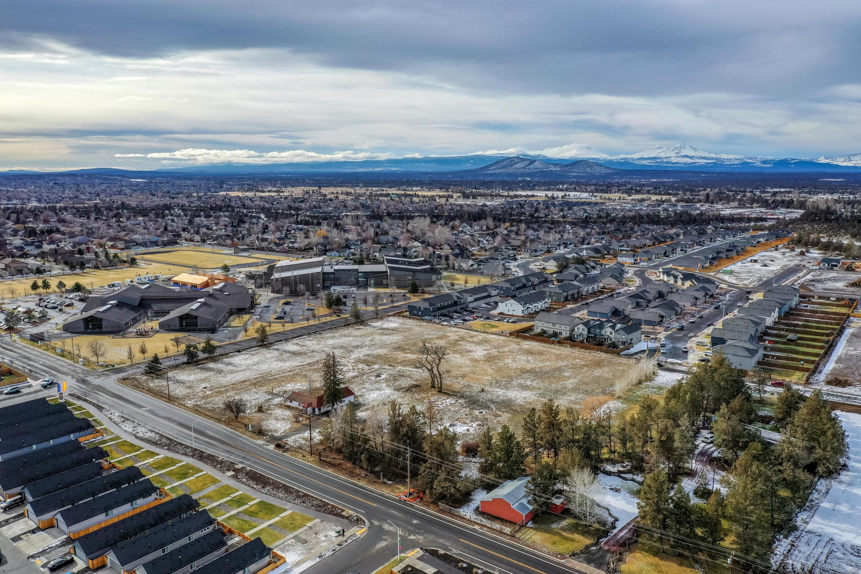 Buildable subdivision opportunity in NW Redmond on 5.26 acres. Zoned R4, with Construction Plat Approval. Utilities at the street, currently approved by city of Redmond for 24 lots. Corner lot on NW 10th and NW Upas, directly across the street from Tom McCall Elementary School. This is a prime development opportunity in Redmond. Current existing structure is ready for demolition, has been certified that no hazardous materials remain.