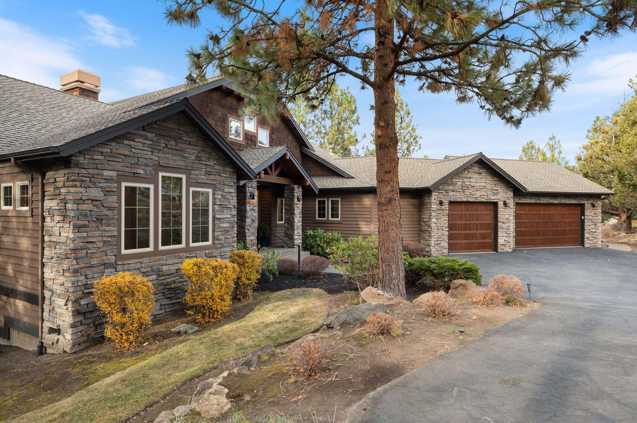 Perched on a .51 acre Westside homesite, this Northwest contemporary captures the kind of Cascade Mountain views that define Bend living. Sunlit spaces, warm wood details, and vaulted ceilings create an elevated yet welcoming atmosphere. Walls of glass frame the peaks, and a wraparound deck blends the indoors with the landscape. Granite counters, a large island, walk-in pantry, and quality appliances shape a kitchen built for real cooking and effortless hosting.

The main level primary suite offers mountain views, a fireplace, new carpet, generous storage, and a spa inspired bath. A dedicated office adds everyday function.

The lower level extends the living space with a media room that opens to the patio, a full second primary suite, and an additional bedroom and bath. Smart home systems, mature landscaping, power sun shades, and an oversized three car garage complete a rare Westside opportunity with standout style and exceptional condition
