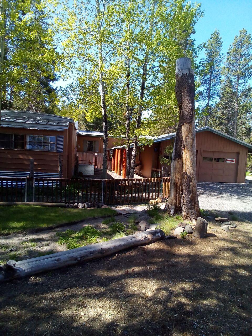 Live in Paradise! Very private .52 acre canal front property surrounded by nature.  Updated and move-in-ready home. 2 Br 1.5 bath. Great open floor plan with stick built family room, bonus room, screened in porch and 2 car attached garage. Enjoy new flooring, walk in shower, updated interior and enticing views from every window. Bring your kayak/canoe and paddle around the canal or into the Deschutes River from your own private dock.  Enclosed back porch for additional outdoor living. Fenced area front and back for kids and pets. Enjoy view of the canal and wildlife everyday of the year.  Cash sale unless you have a lender who will finance a 1972 Mfg. home. Willing to work with Buyer's agent. Lender available for this property.