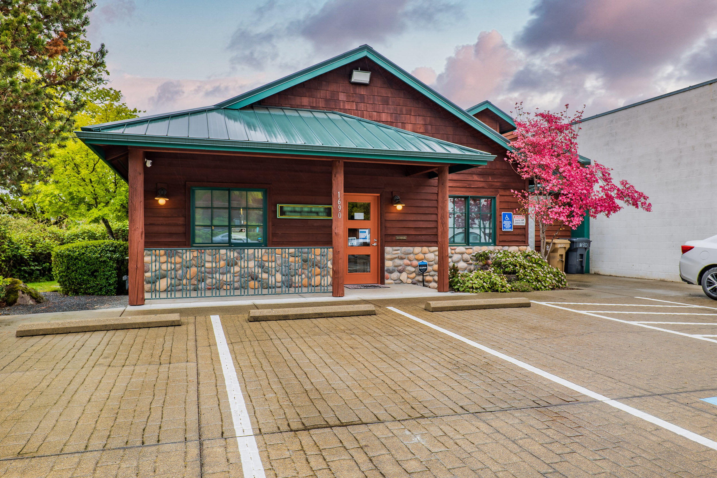 Beautiful and completely remodeled in 2020 this State of the Art  Professional Medical Office Building in the  north end of town offers 3 exam rooms all with solid surface counters and sinks, nurses station that seats 2, kitchenette, 2 office spaces, lab, supply room with built in storage, reception area and gorgeous waiting room with vaulted ceilings and gas fireplace.  Quiet and tucked away with plenty of parking, a steel roof, and shake siding that has been stained and repainted in 2021 this is an opportunity you don't want to miss!