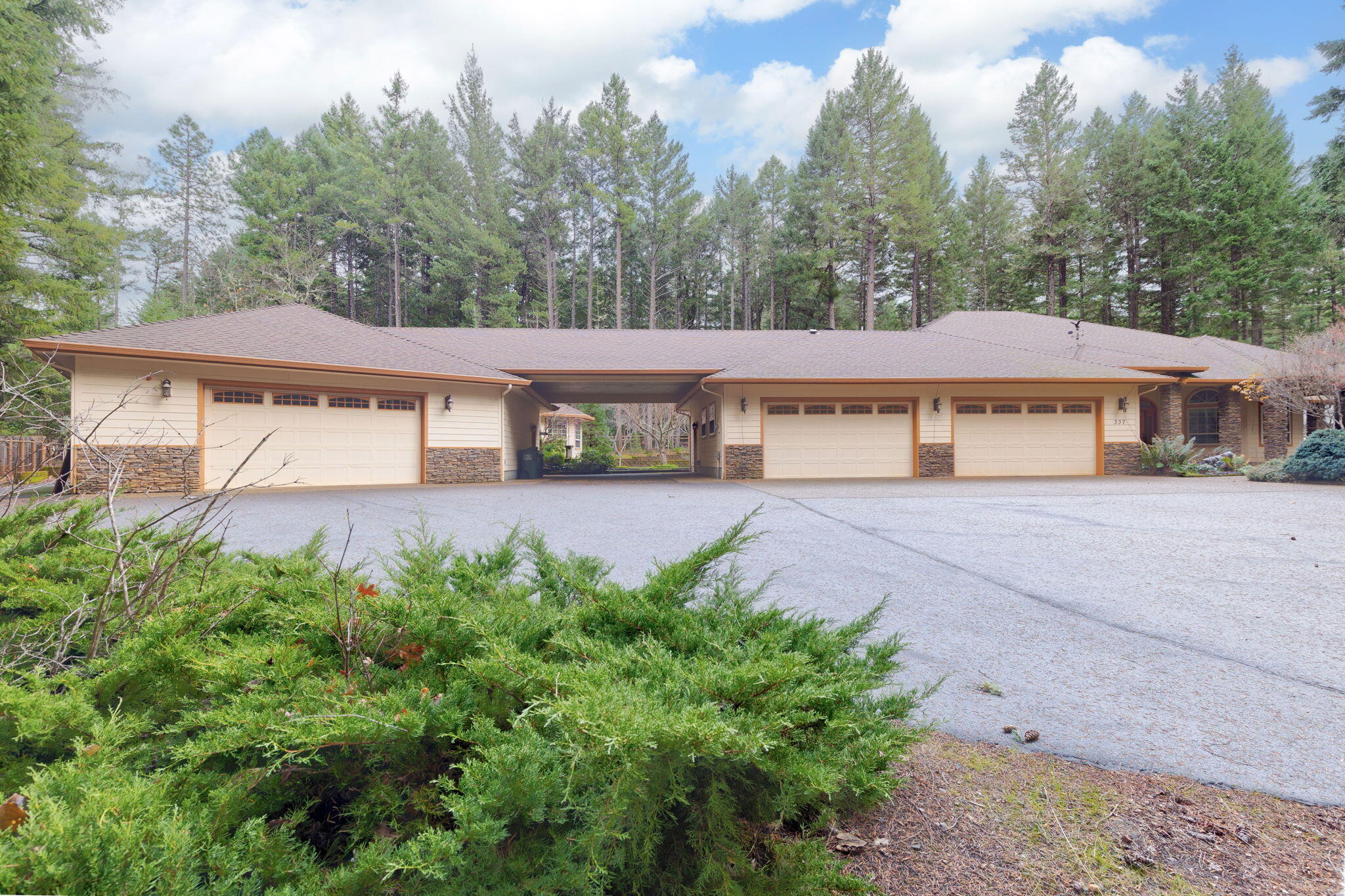 Tucked away in a quiet, peaceful country setting, this spacious 3,021 square foot home sits on 2.5 beautiful acres just about 20 minutes from Grants Pass. The home offers a comfortable and functional layout and has just received a complete interior paint refresh, giving it a clean, move-in-ready feel throughout. With 3 bedrooms, 2.5 bathrooms, and multi-use spaces, this home offers comfortability and fantastic spaces for gathering and entertaining. One of the standout features of this property is the incredible shop and garage space. In addition to a 4-car garage, the property includes an approximately 2,300 square foot shop ideal for hobbies, equipment, storage, or so much more! Enjoy the privacy, space, and serenity of rural living while still being within easy reach of Grants Pass amenities. Properties offering this combination of acreage, shop space, and a large home are hard to find- this one is a must see!