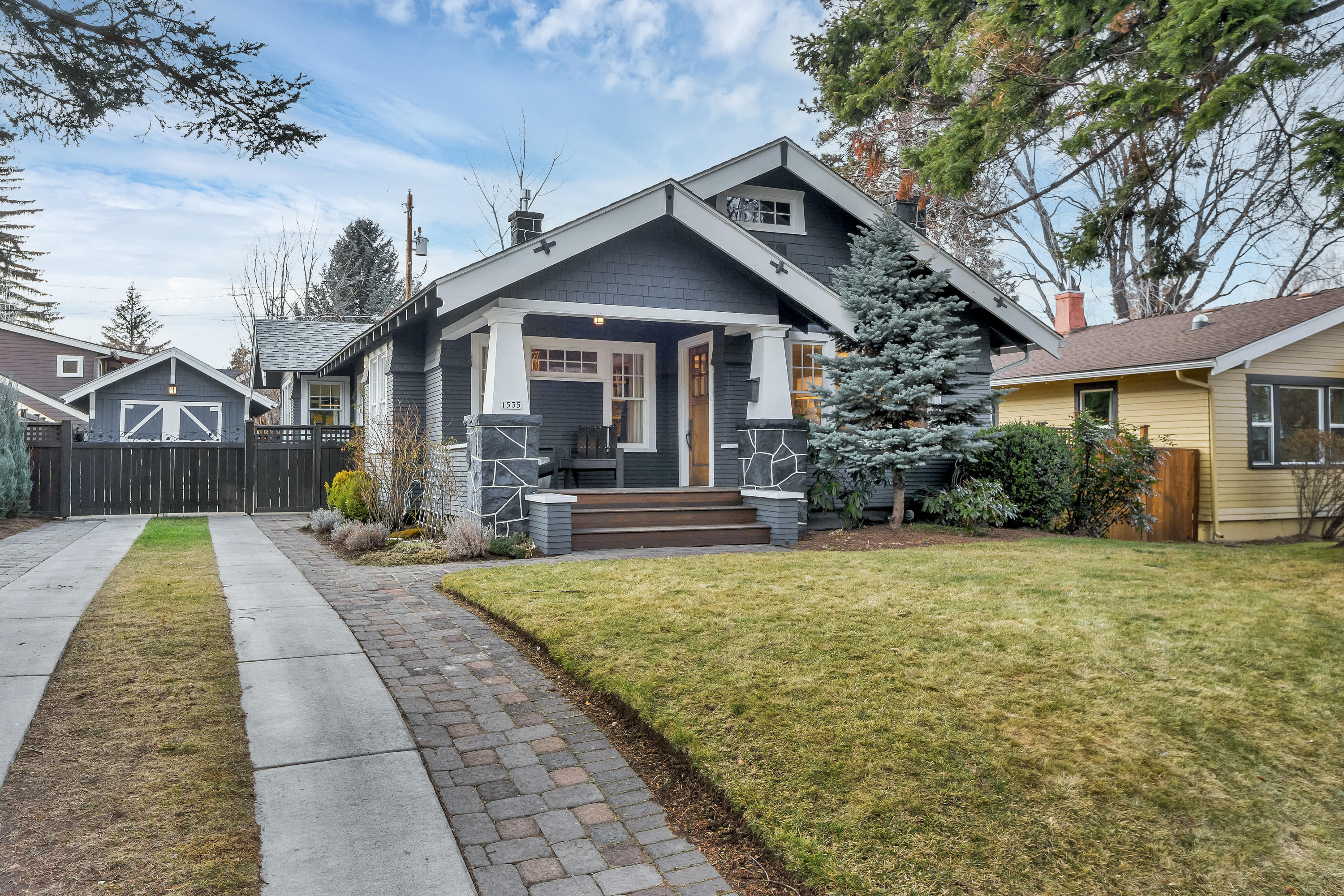 Charming NW Bungalow located in the heart of Bend and a few short blocks from downtown. Built in 1922, but completely renovated to include the modern features you desire, while staying true to its classic style. Original hardwoods throughout the upstairs, cooks kitchen with Wolf range and stainless appliances.  Upstairs boasts family room with wood burning fireplace, dining room, kitchen with sunny breakfast nook, 2 bedrooms and full bath.  Downstairs is an 1148 sq. ft. daylight basement perfect for a bonus room, office or both, with another bedroom and luxurious full bath.  Relax on the spacious front porch and entertain your friends on the back deck complete with tree house for the kids.  Garage is ready for your car, toys or turn it into your home office or she-shed.  This house is ready and waiting for its new owners who want to experience all that Bend has to offer.