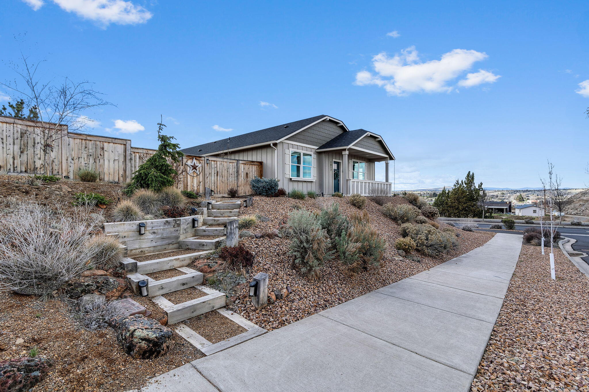Move-in ready and better than new! This beautiful 3 bed, 2 bath single-level home, built in 2020, is nestled on a corner lot in the highly desirable Yarrow subdivision. Enjoy stunning panoramic Cascade Mountain and city views, a fully fenced yard, professional landscaping, and HOA-approved RV parking. The open, light-filled layout features a natural gas fireplace framed by windows, wide-plank laminate flooring, and a thoughtfully designed split floor plan for added privacy. The kitchen shines with quartz countertops, a full tile backsplash, island, pantry, and a versatile nook ideal for a coffee bar or home office. The spacious primary suite boasts dual closets, direct patio access, and a spa-like bath with double sinks and a full tile shower. Custom lighting throughout. Covered patio perfect for entertaining, plus a tandem 3rd car garage with flexible space for a workshop or currently housing a 16 foot boat. This is Central Oregon living at its bestâ€”schedule your showing today!