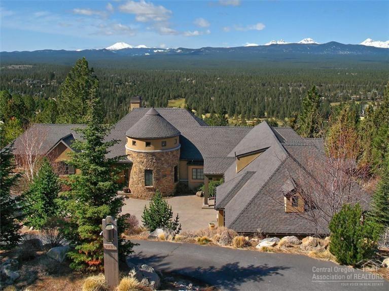Elegant, custom Awbrey Butte home with full Cascade Mountain views & open floor plan. 2 en suite bedrooms upstairs (master option on main) + half baths, with master + 2 bedroom suites & AV-game room below. Sunny art studio w/ French doors to terrace; view-inspiring office; 2-story library w/ FP in turret; gourmet kitchen; deluxe mud room w/ W/D, lockers, dog bath; gear room 2/lockers, vault, hobby table. Radiant heat floors throughout + solar assist; low maintenance indoors & out. 5-car garage + storage.