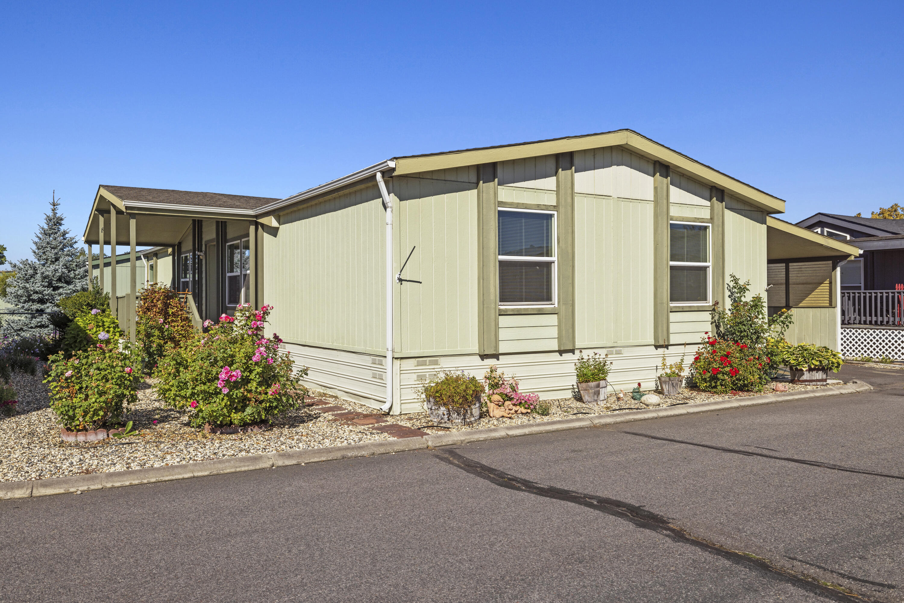 Step inside to find generous square footage, vaulted ceilings, and an open floor plan that feels bright and inviting. The kitchen shines with a large island, granite countertops, updated tile work, and modern finishes, while a dedicated laundry room adds everyday convenience. Outside, enjoy a covered carport, storage shed, and a charming deck framed by flower beds—a wonderful spot to sip your morning coffee or unwind at the end of the day. With recent improvements both inside and out, this home is move-in ready and waiting for its next owner.
Come see why this property stands out as a great opportunity in a vibrant 55+ community!